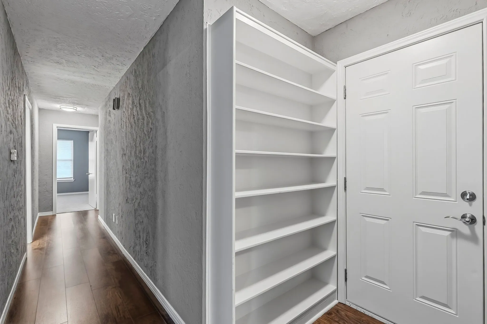 MORE SHELVING IN HALLWAY