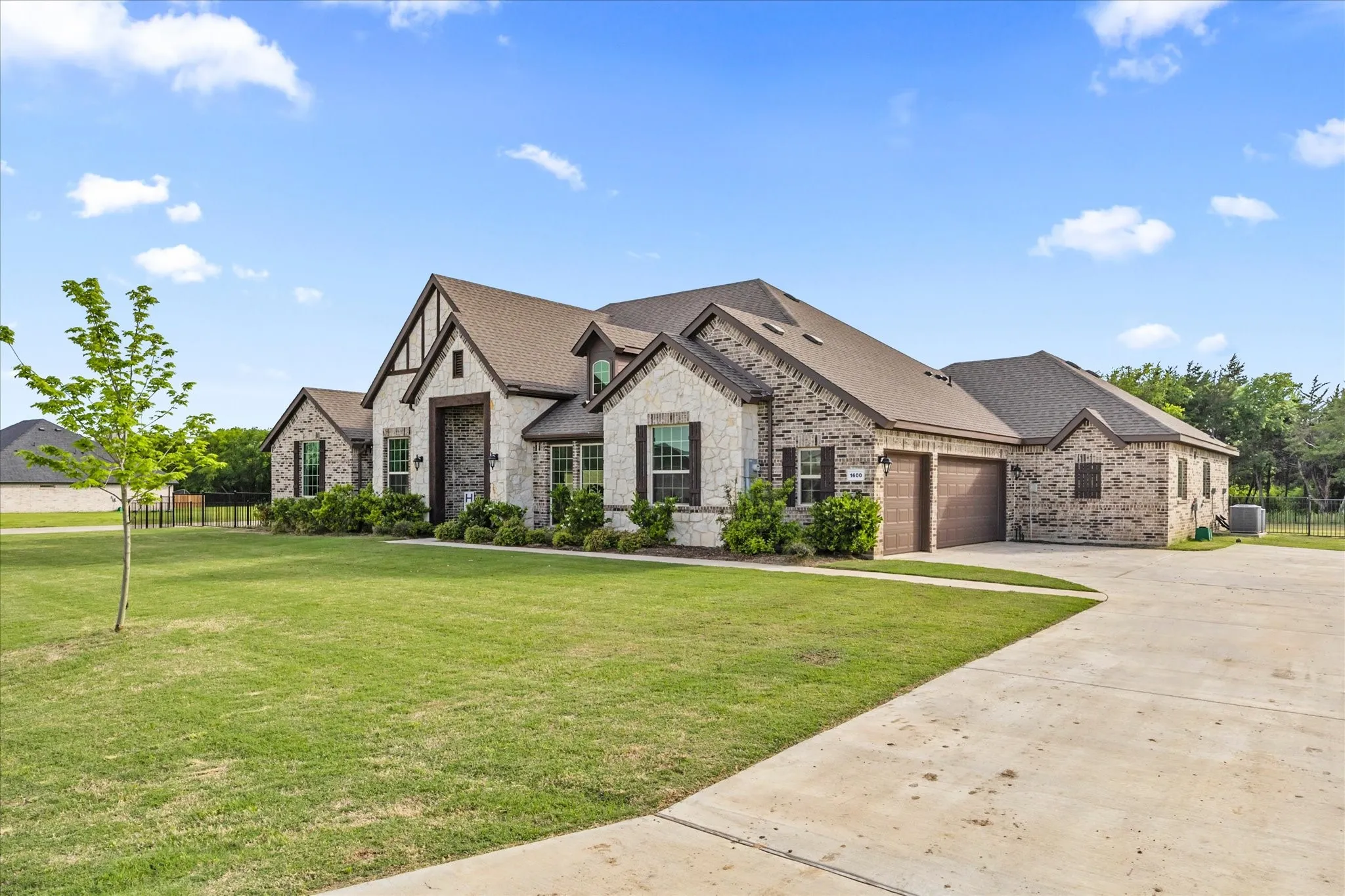 3 CAR ATTACHED GARAGE WITH OVERSIZED DRIVE