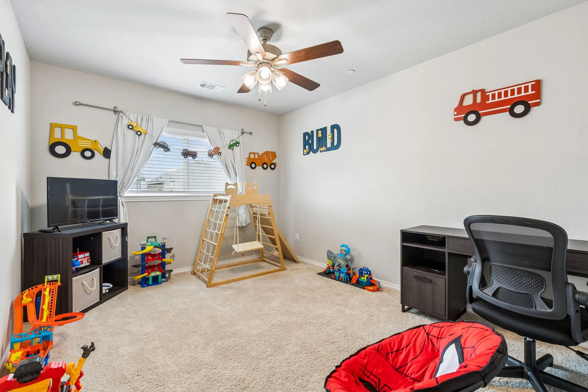 secondary bedroom with large walk in closet
