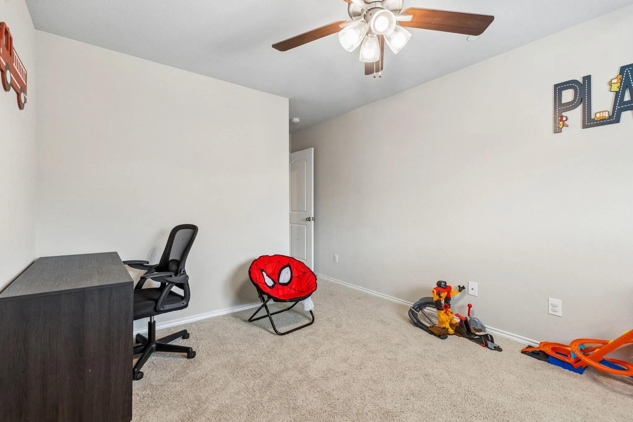 secondary bedroom with large walk in closet