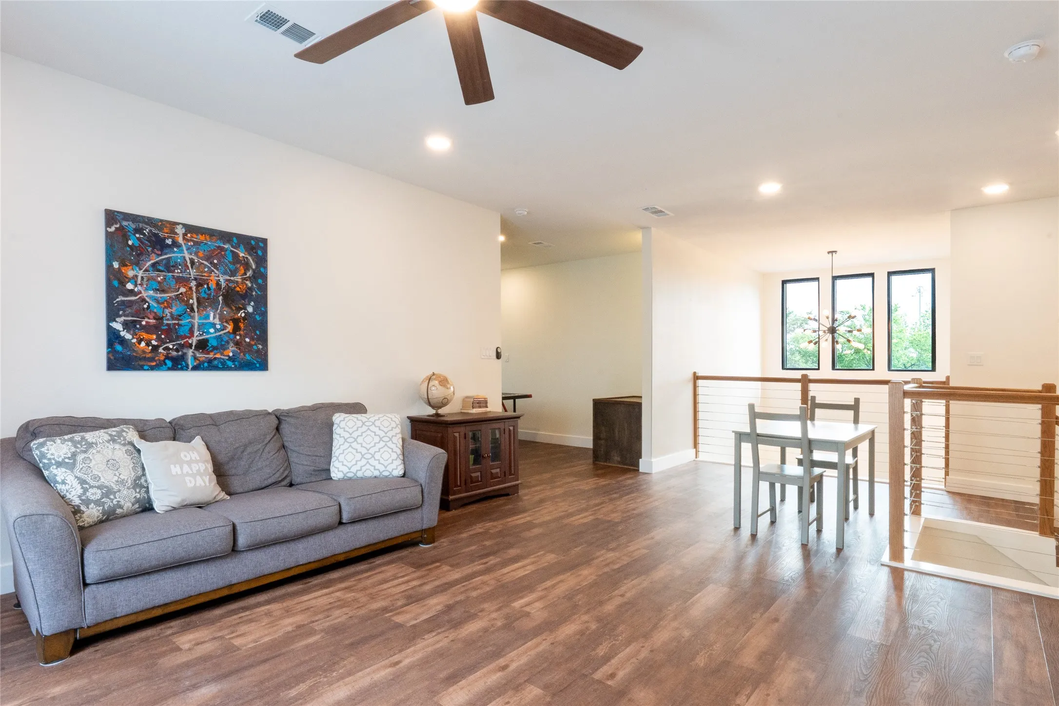 Spacious living area featuring, walk out balcony, and extra game room, recessed lighting, and a ceiling fan