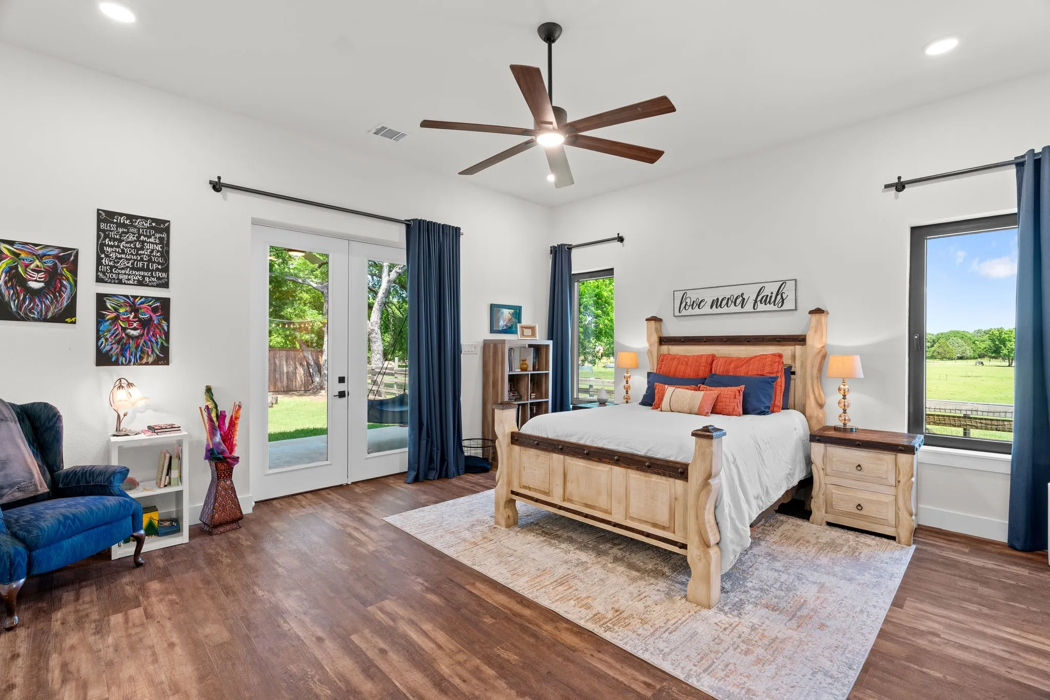 Spacious room featuring wood-finish flooring and bright white walls