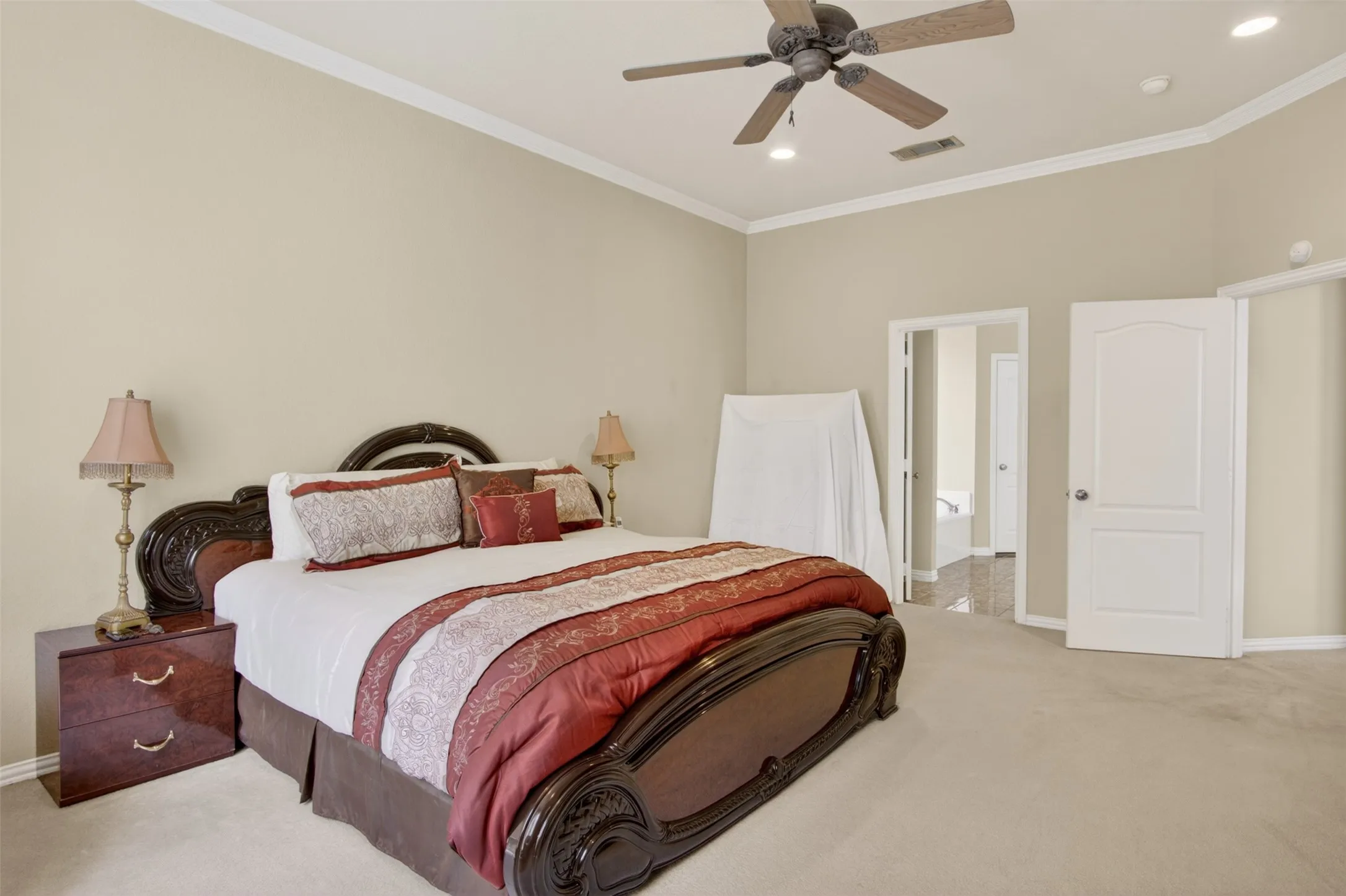 Spacious room with vaulted ceilings and crown molding