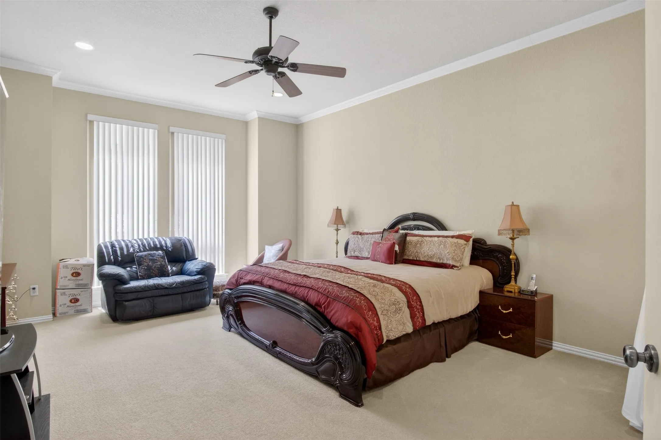 Carpeted room with a ceiling fan, recessed lighting, and crown molding