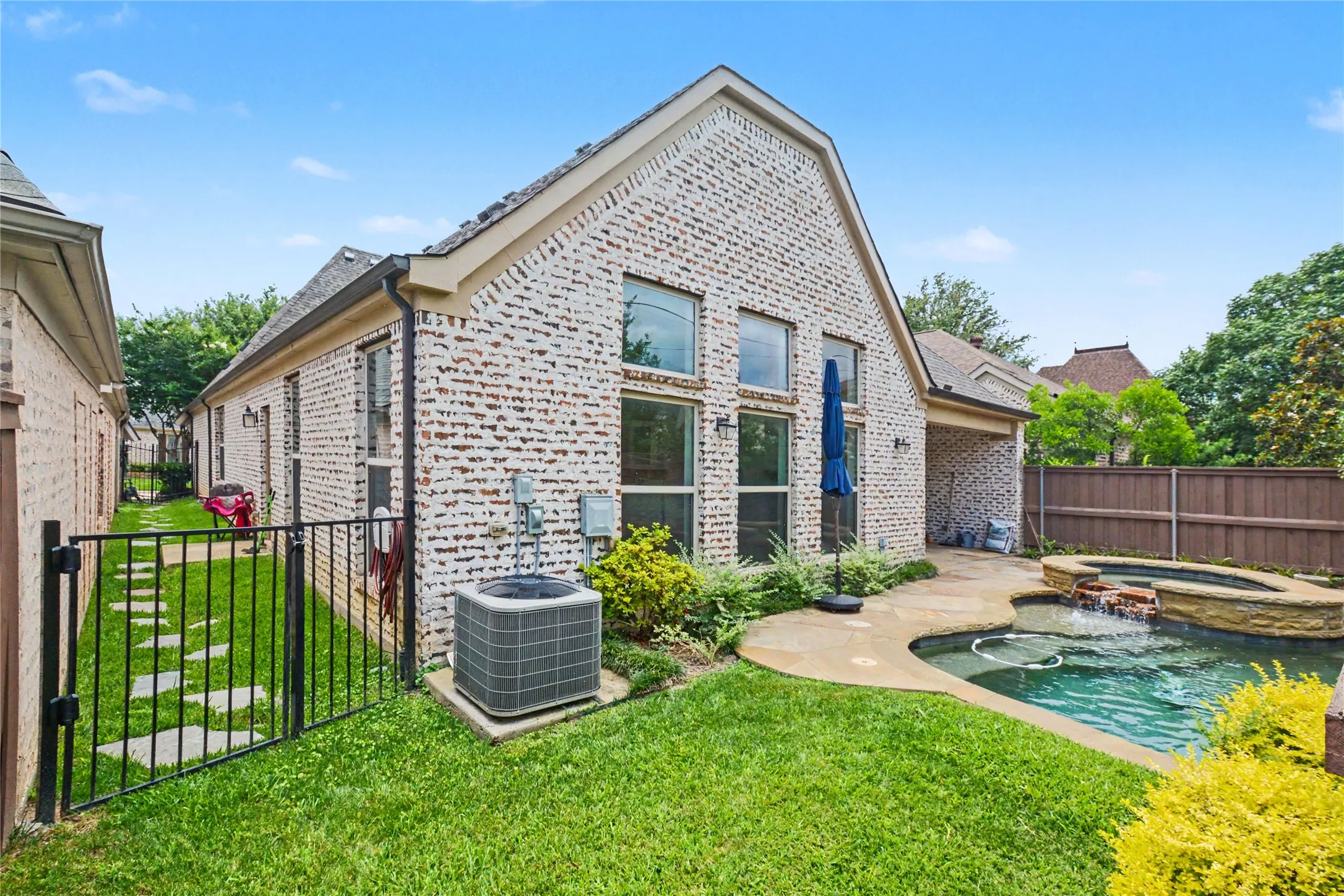 The other side of the backyard offers plenty of grass. Perfect for your furry, four legged family members.