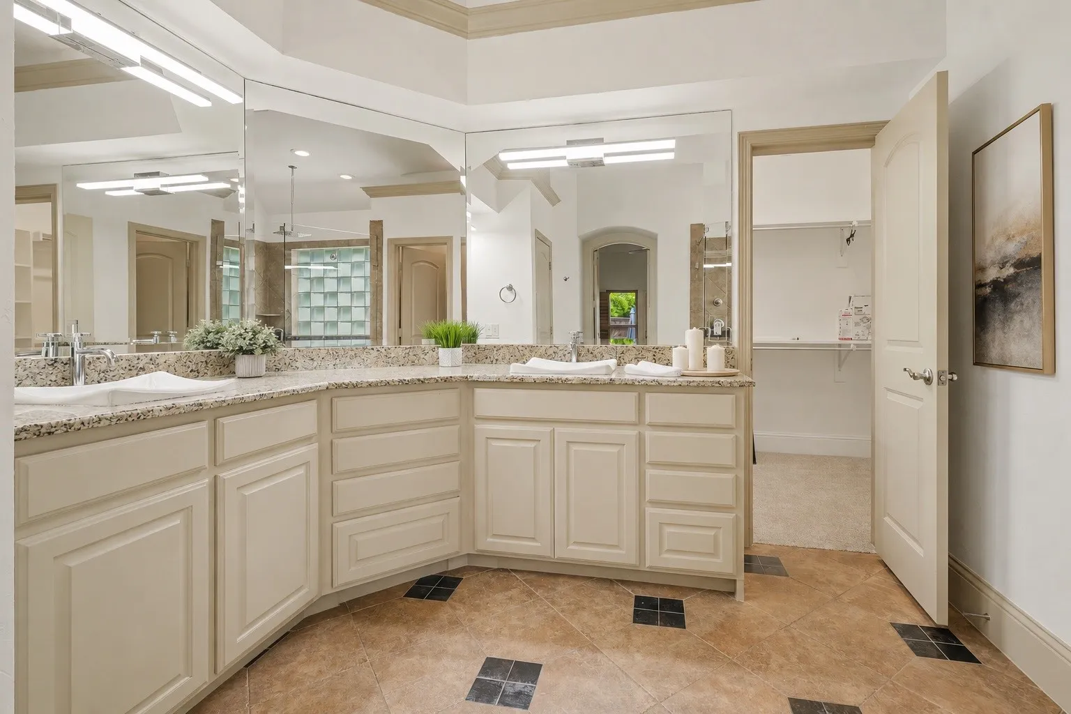 Primary bathroom is a spa-like retreat. Light and nright with a glassed in shower and separate tub, and a huge closet.