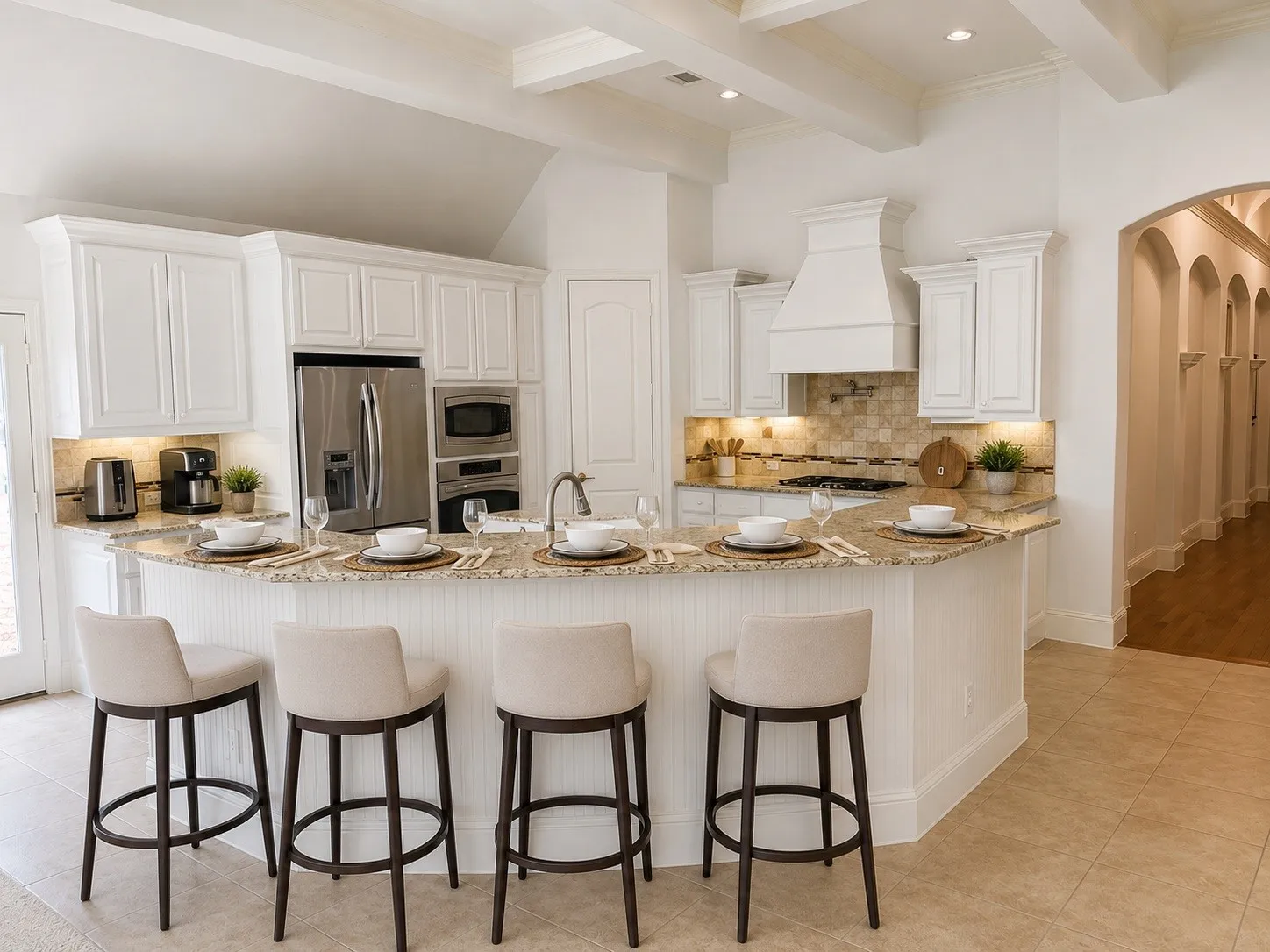 The kitchen provides plenty of space to cook or chat. Stainless appliances, gas cook top and commercial quality vent.