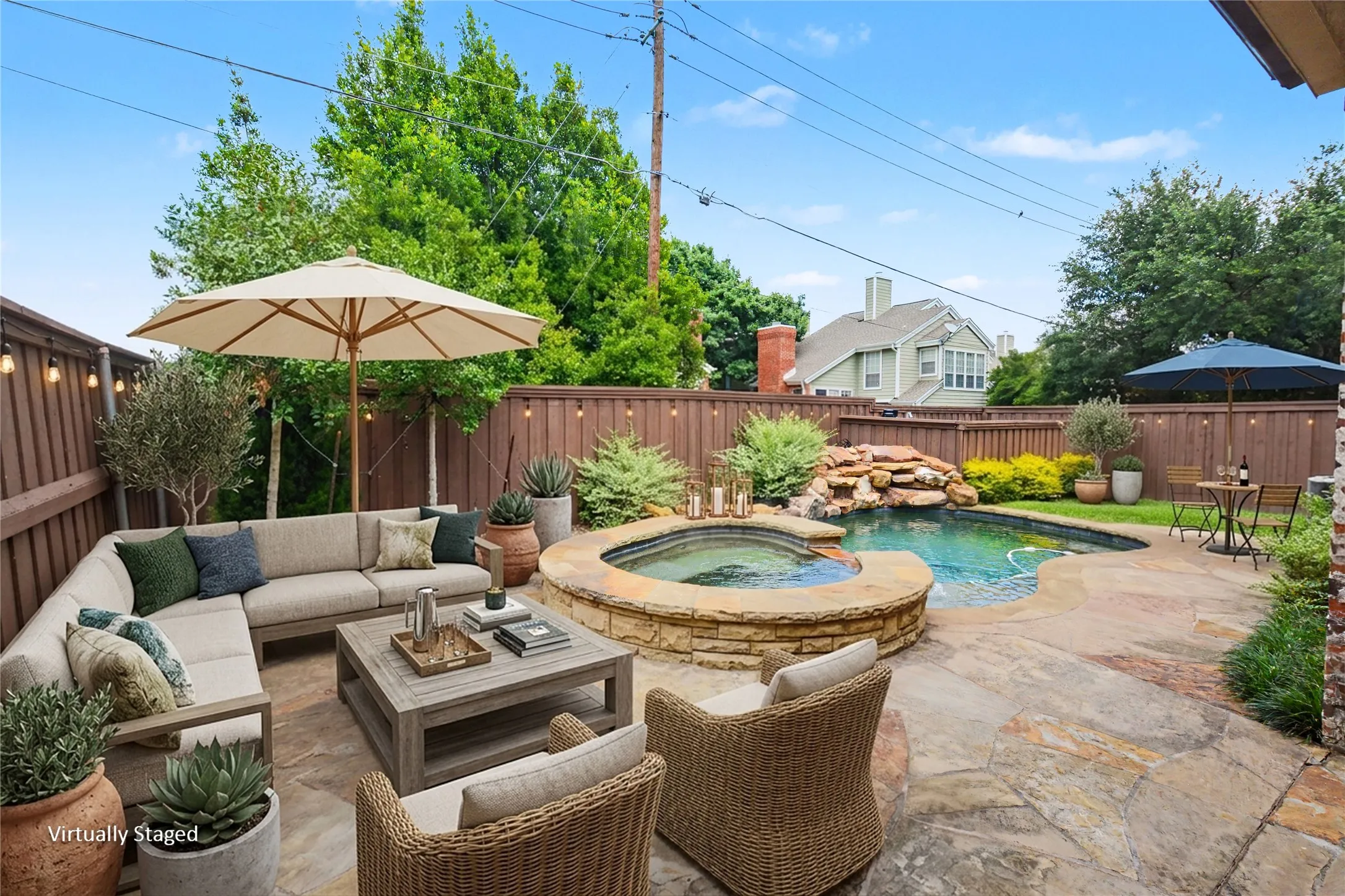 Resort quality pool with waterfall and spill over spa. Plenty of deck around the pool to accomodate your outdoor living arrangement.