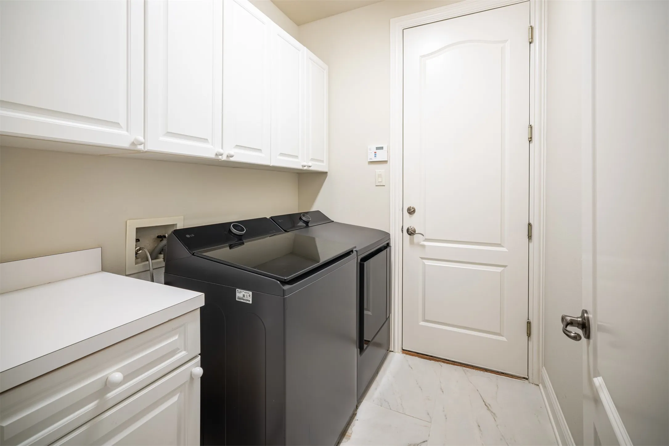 Utility Room with ampleBuilt-Ins