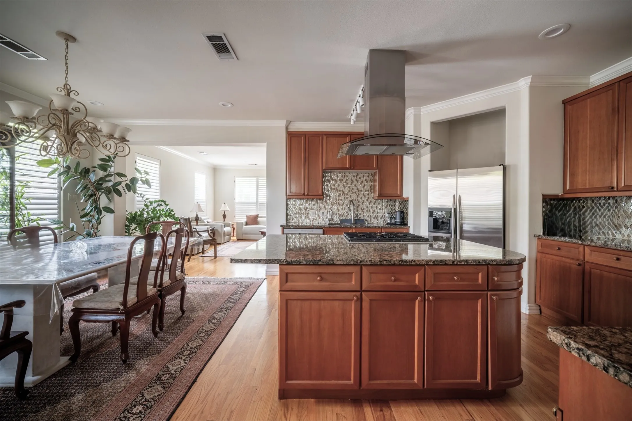 Kitchen opens to Dining and Living