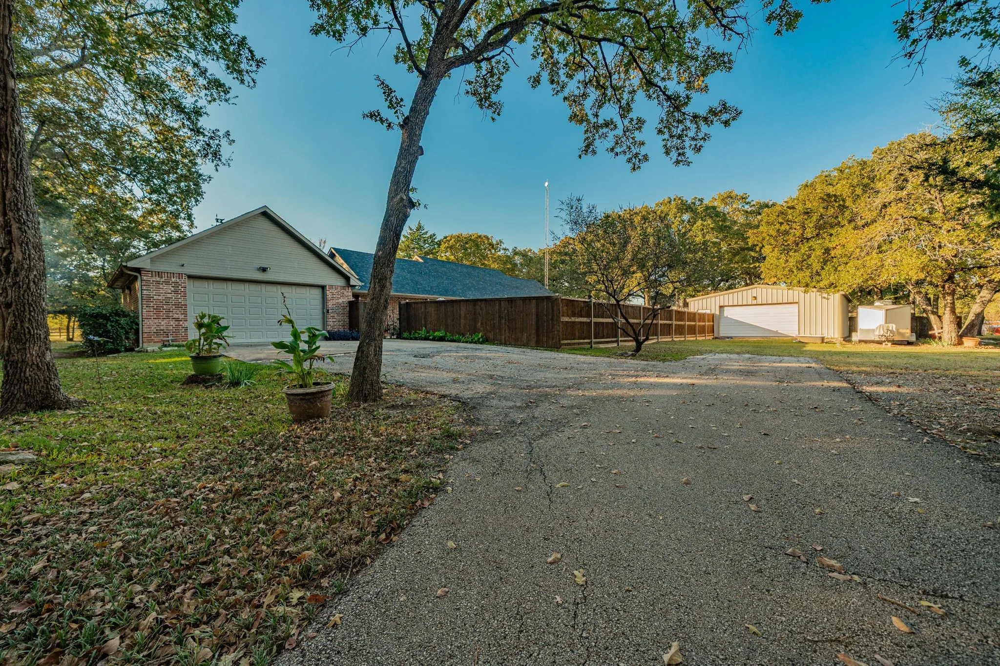Brick and siding exterior featuring an attached two-car garage