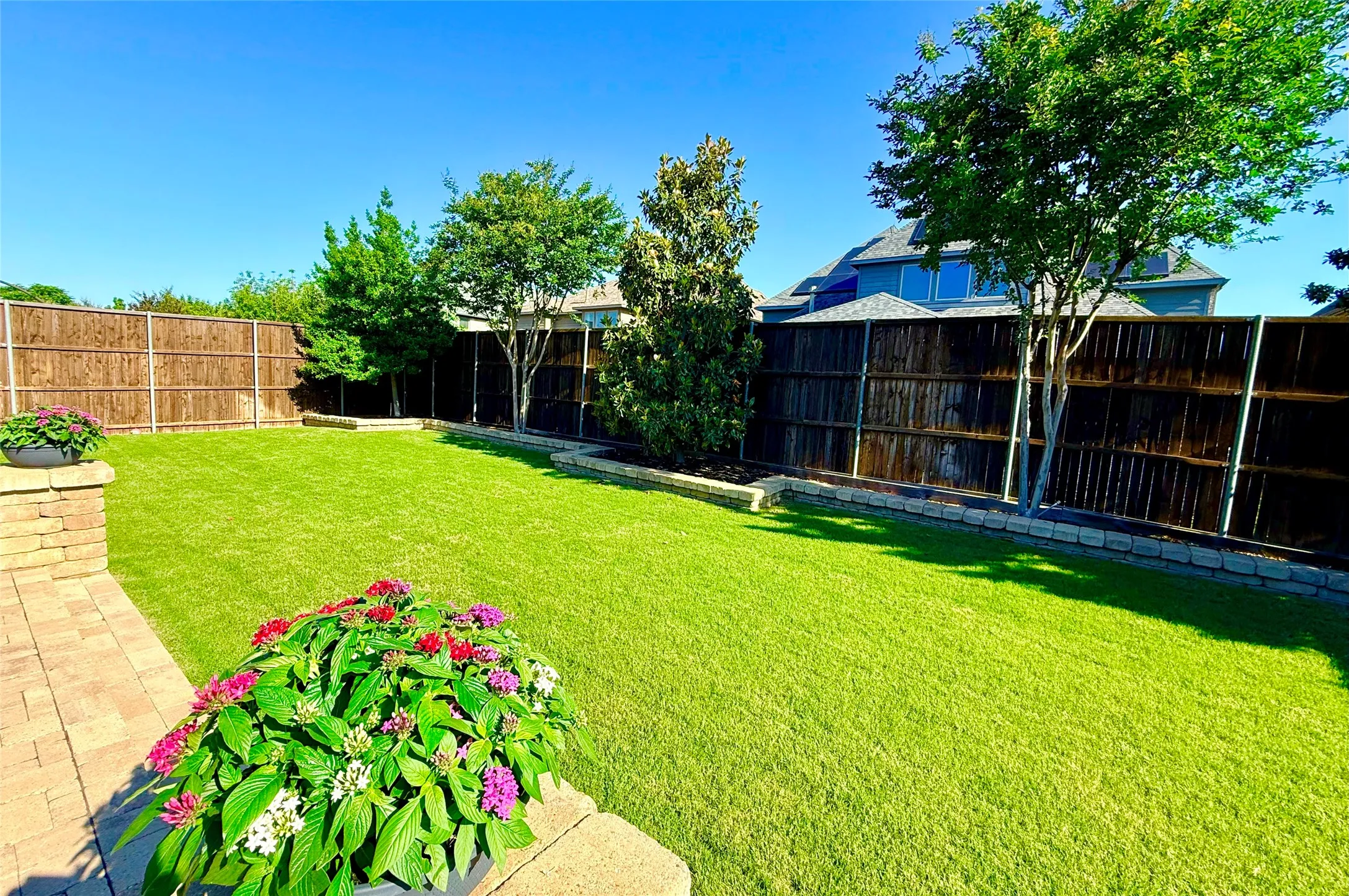 Beautiful Backyard with raised beds and mature trees