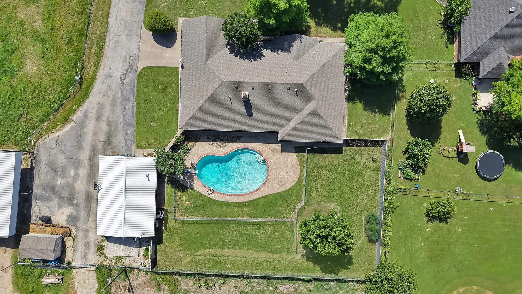 Overhead view of house, pool, bunkhouse