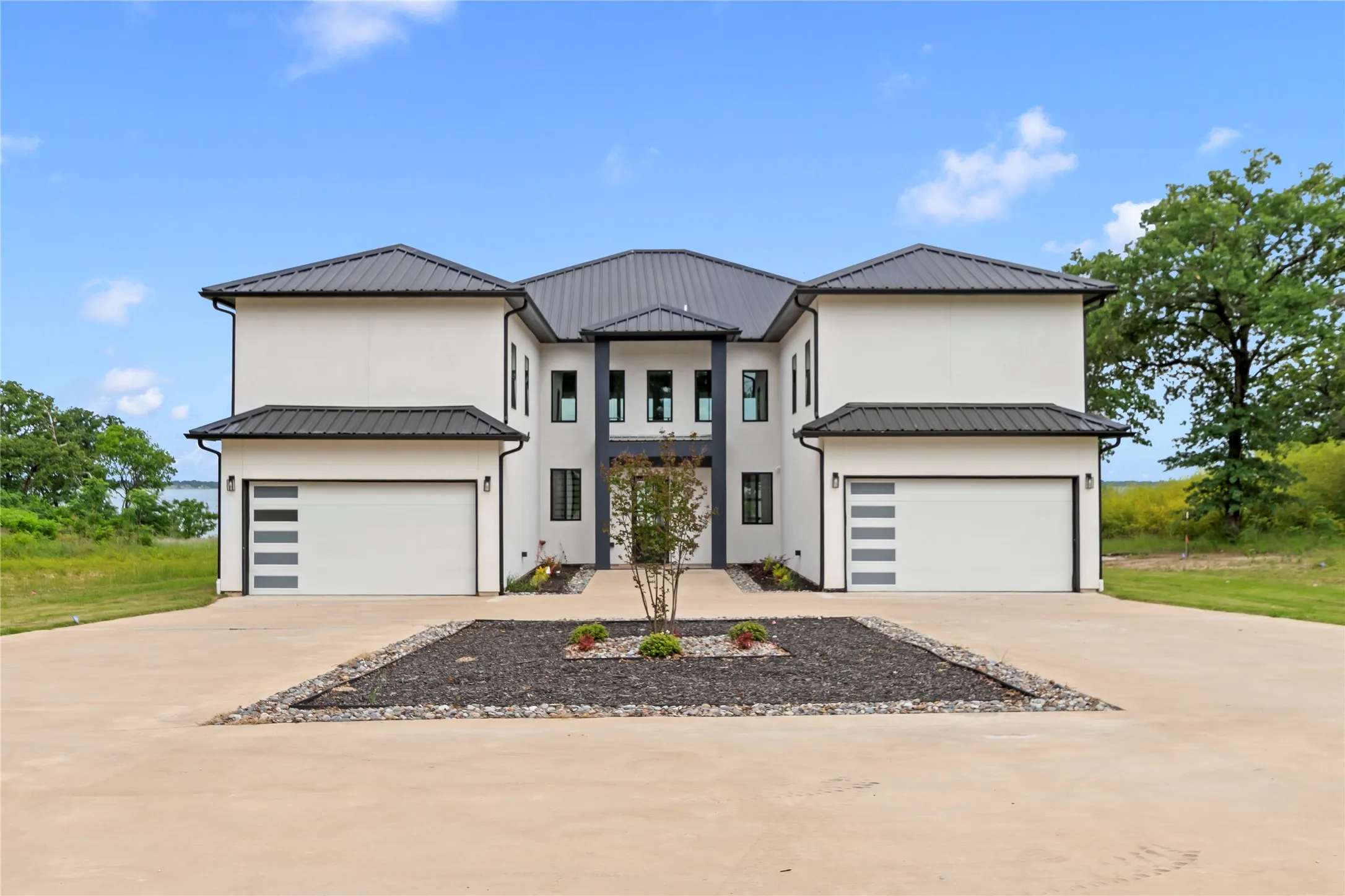 Expansive circle driveway with two, two car garages. Plenty of parking for guest, boat trailers, golf carts, etc.