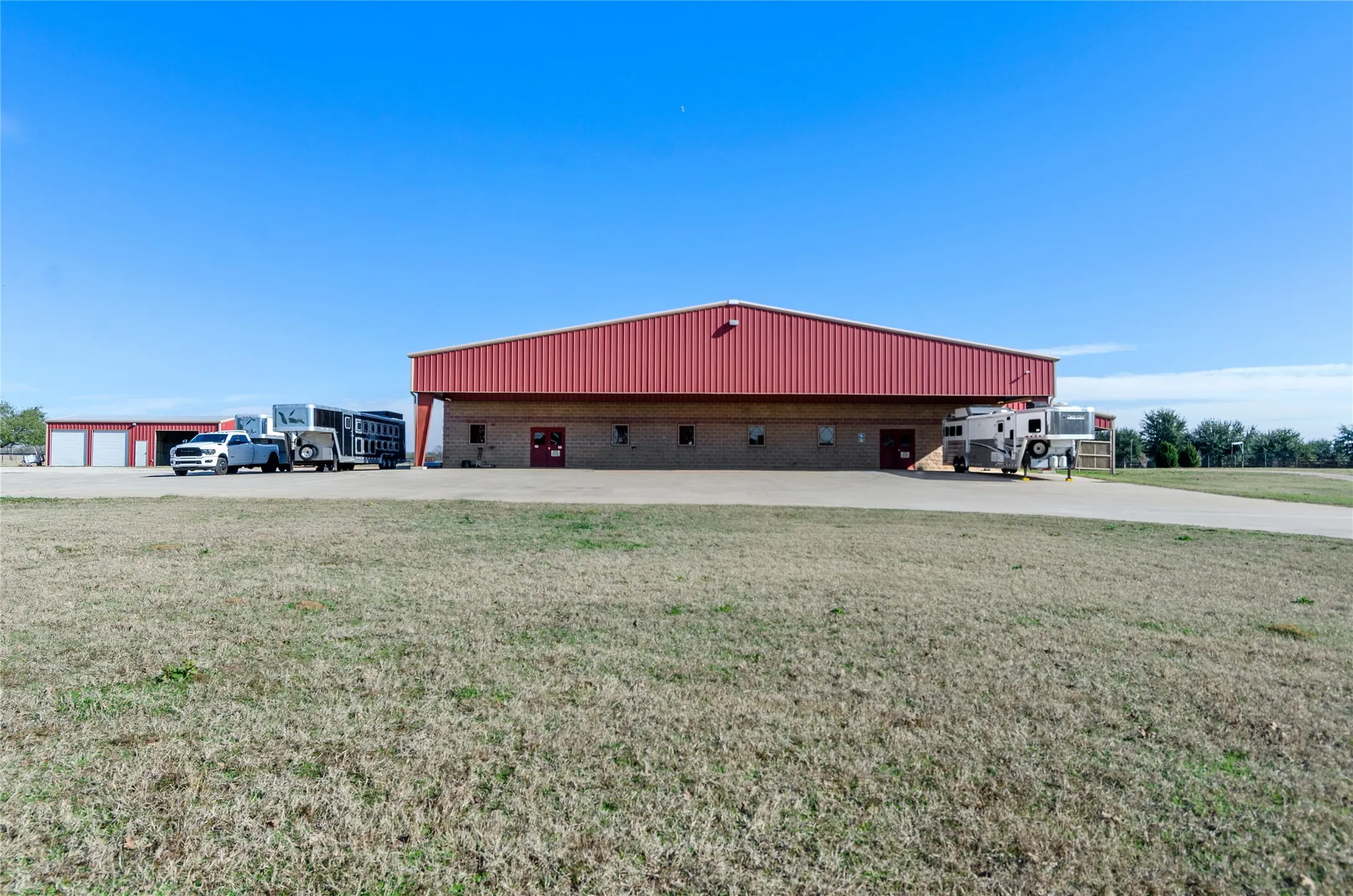 View of building exterior with a detached garage