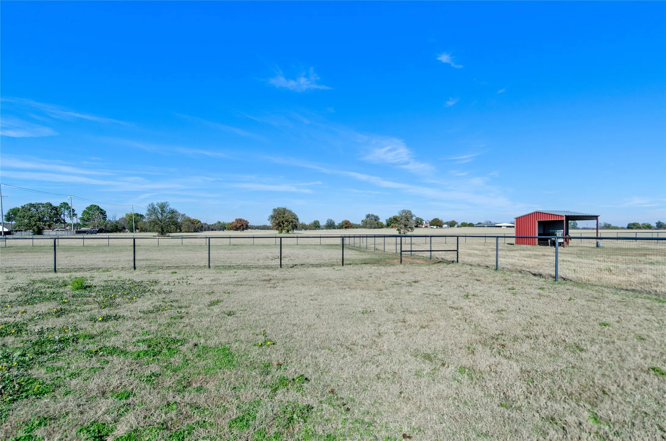 View of yard featuring a view of countryside and an outbuilding