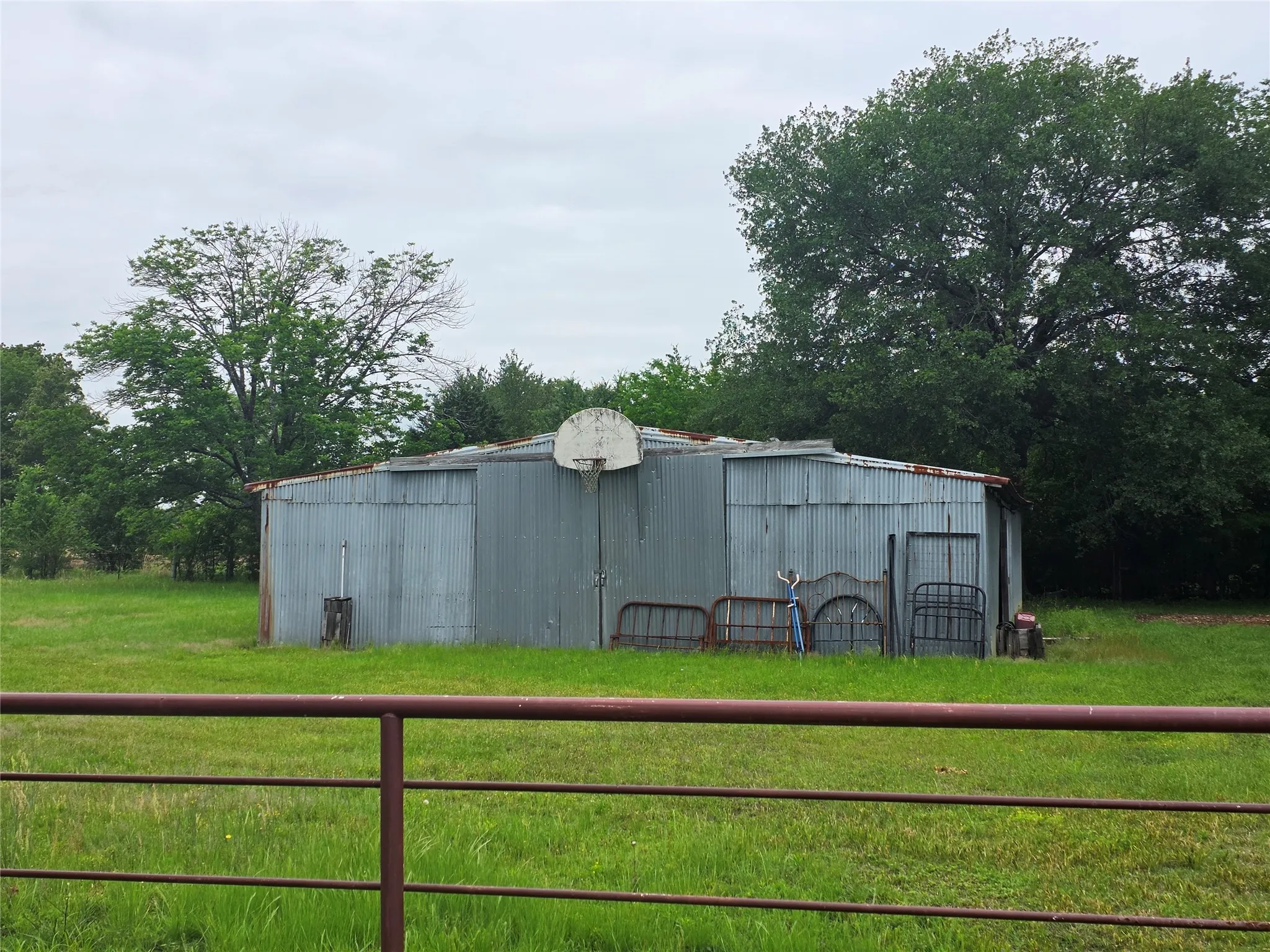 Corrugated metal outbuilding with a sloped roof