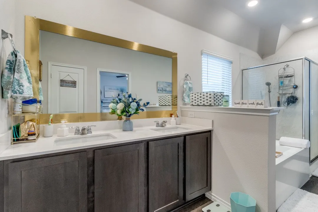 Dual vanity with integrated sinks and chrome fixtures