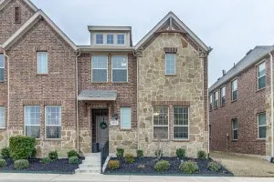 Façade featuring a combination of brick and stone masonry