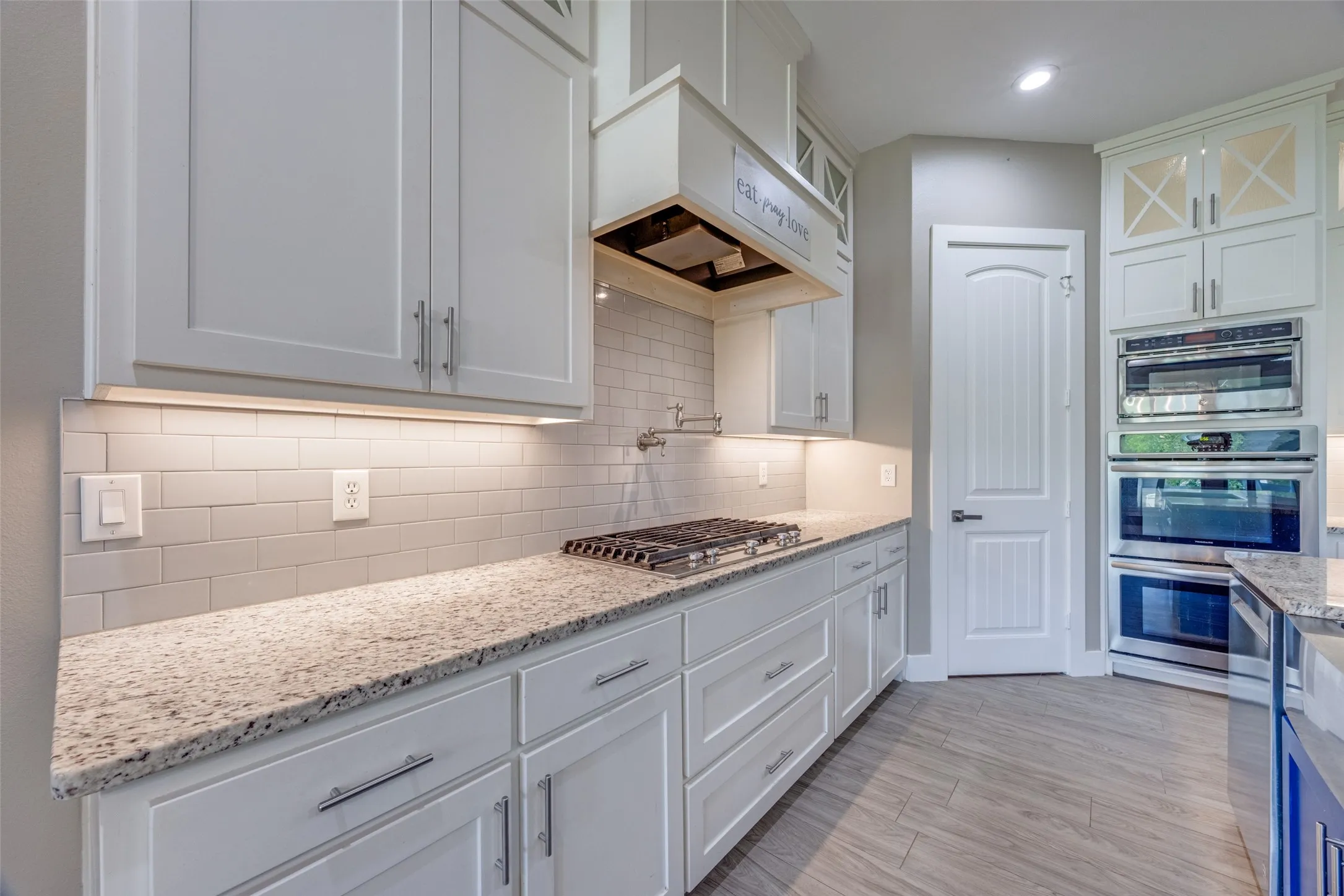 Kitchen with chef inspired gas cooktop.