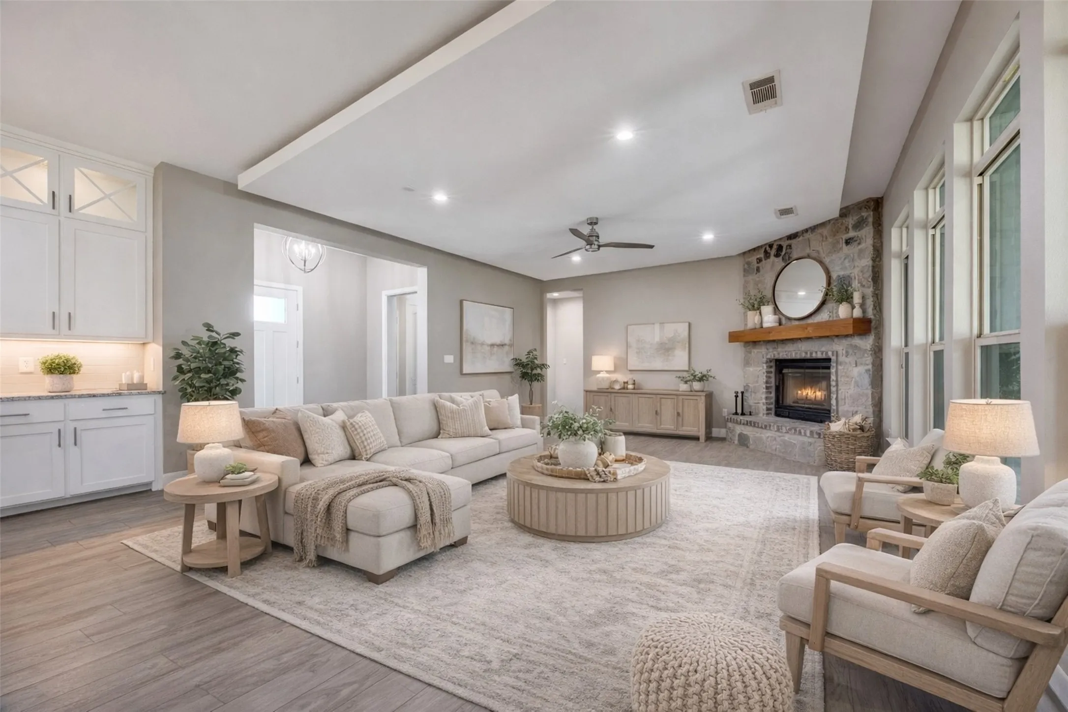 Living area flowing into the kitchen and dining area.  Virtually staged.