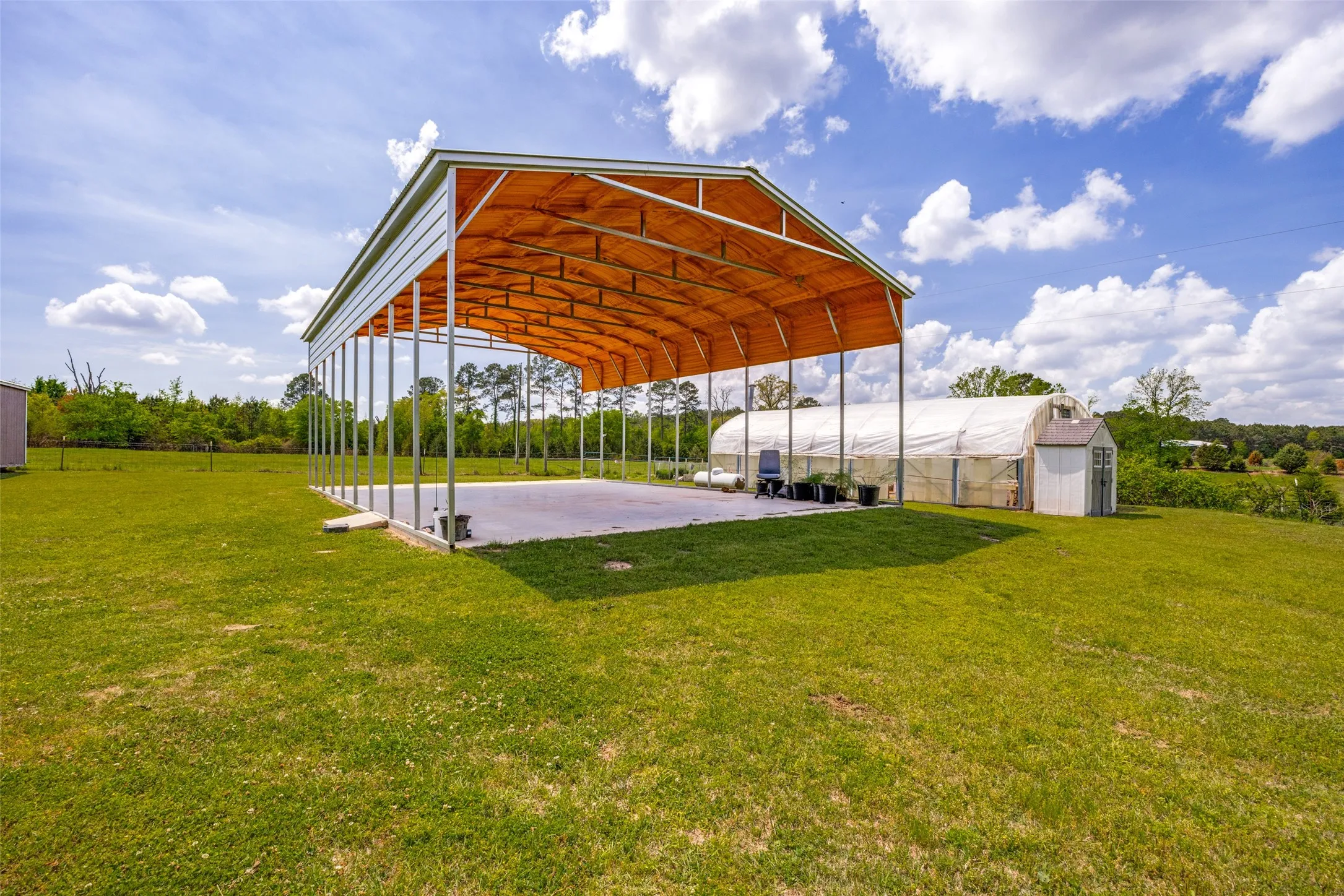 One of 2 RV pads with covers on the property.