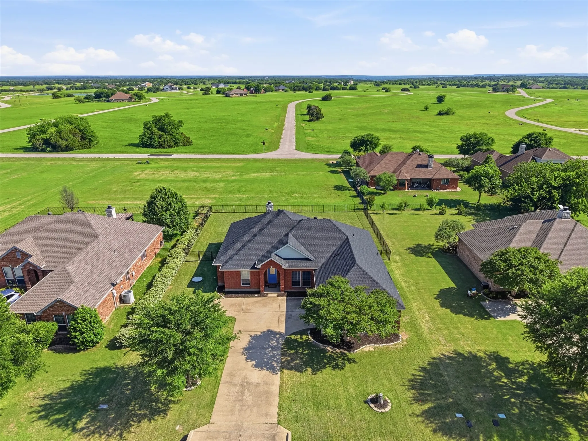 Aerial view of front of the home within the community of The Retreat.
