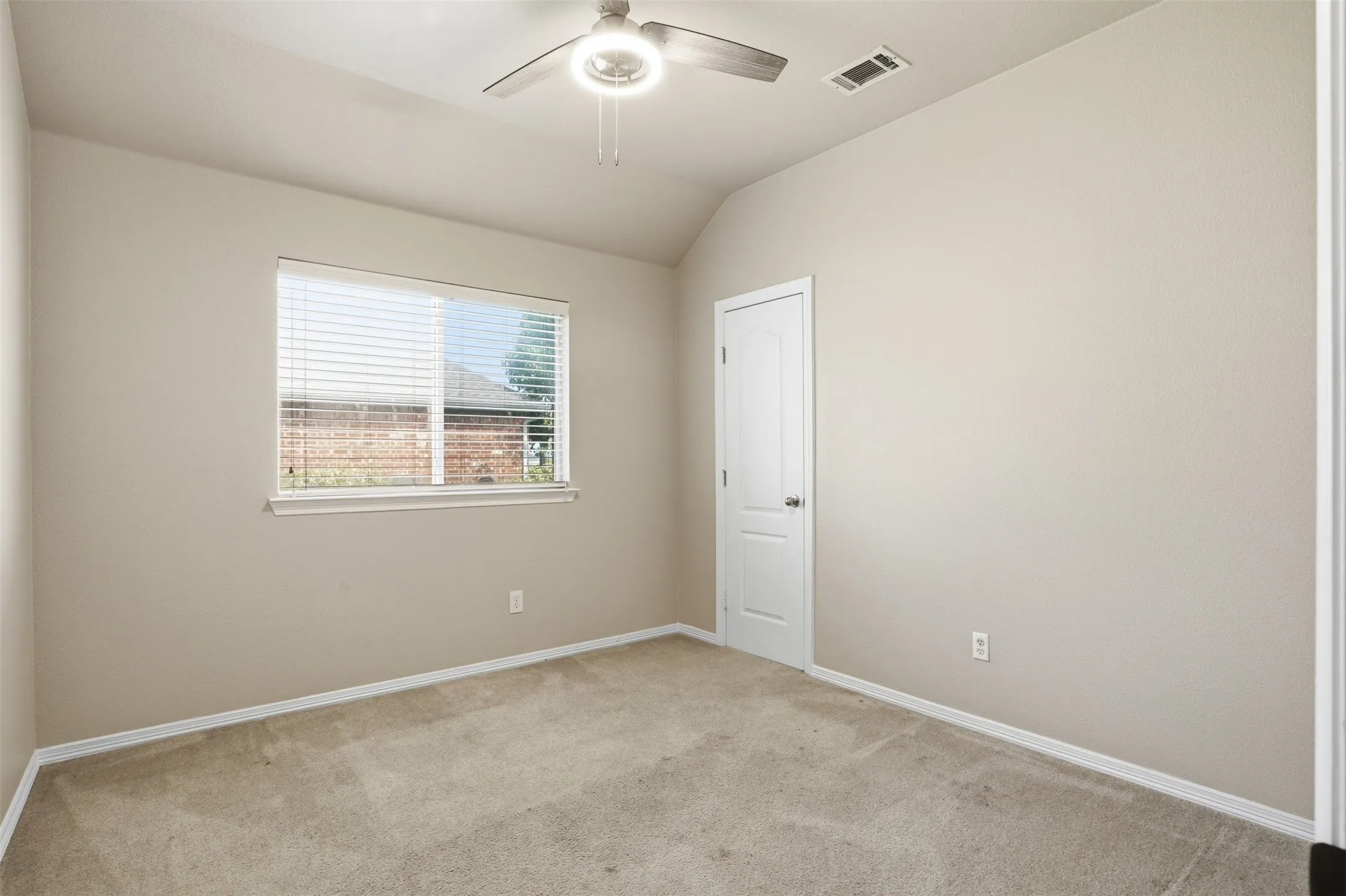 Bedroom #3 with neutral paint, carpet, ceiling fan with integrated lighting, and single window that offers plenty of natural light.