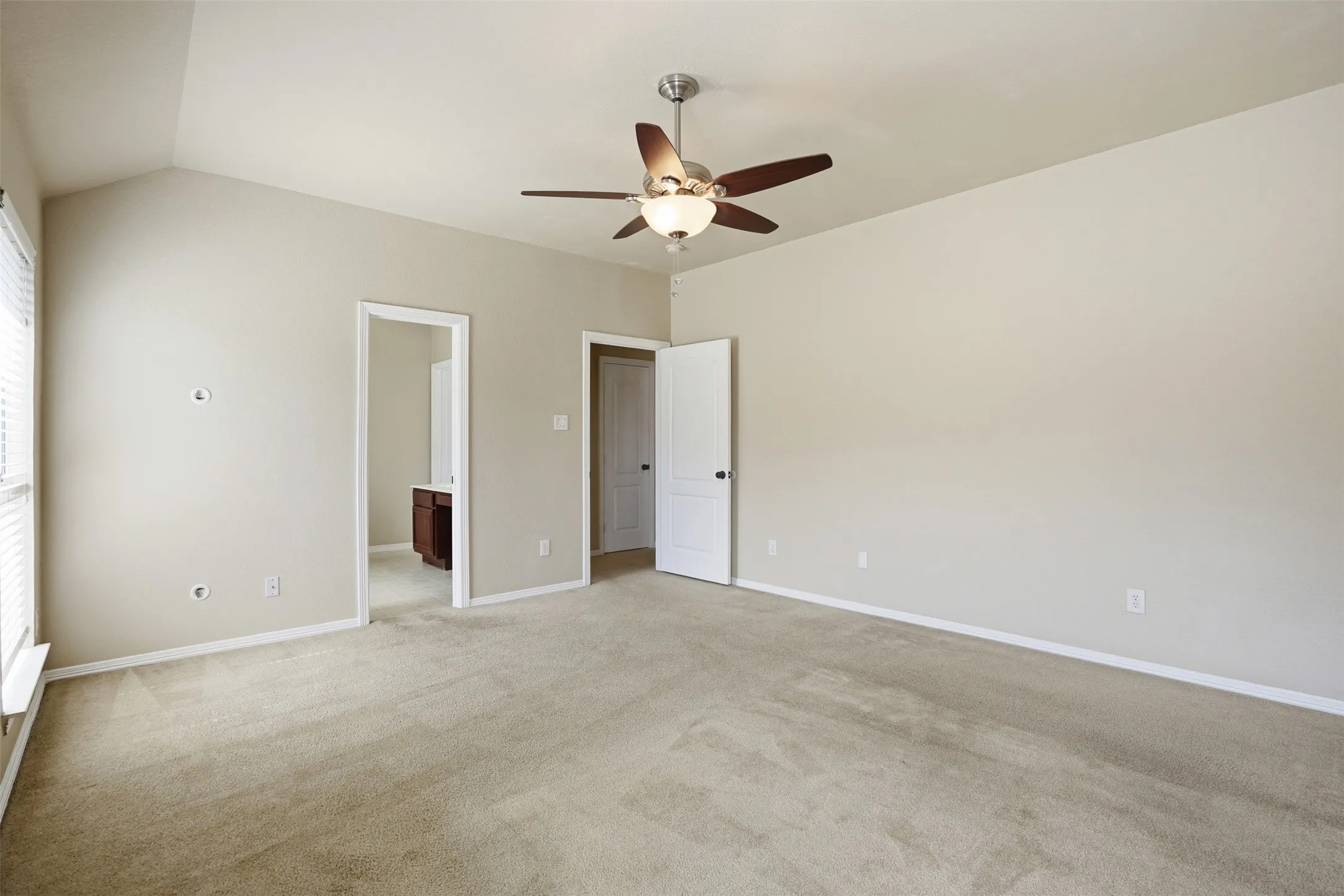 Spacious primary bedroom featuring featuring it's own ensuite bath.