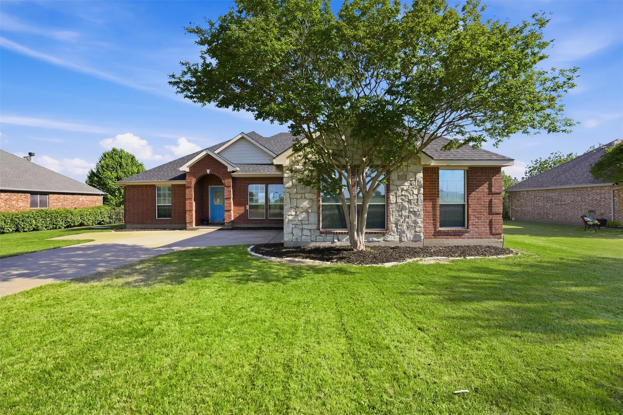 Brick and stone 4 bedroom, 2 bath home in the gated community of The Retreat.