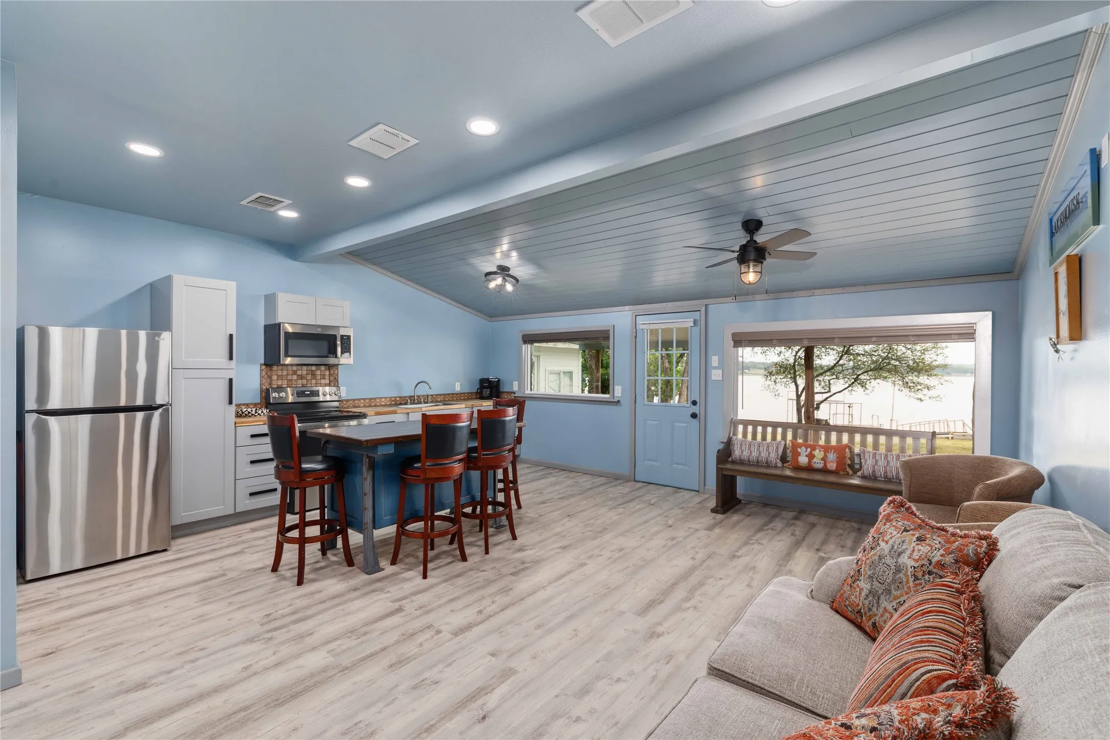 Open concept living space with large picture windows that overlook Lake Brownwood.