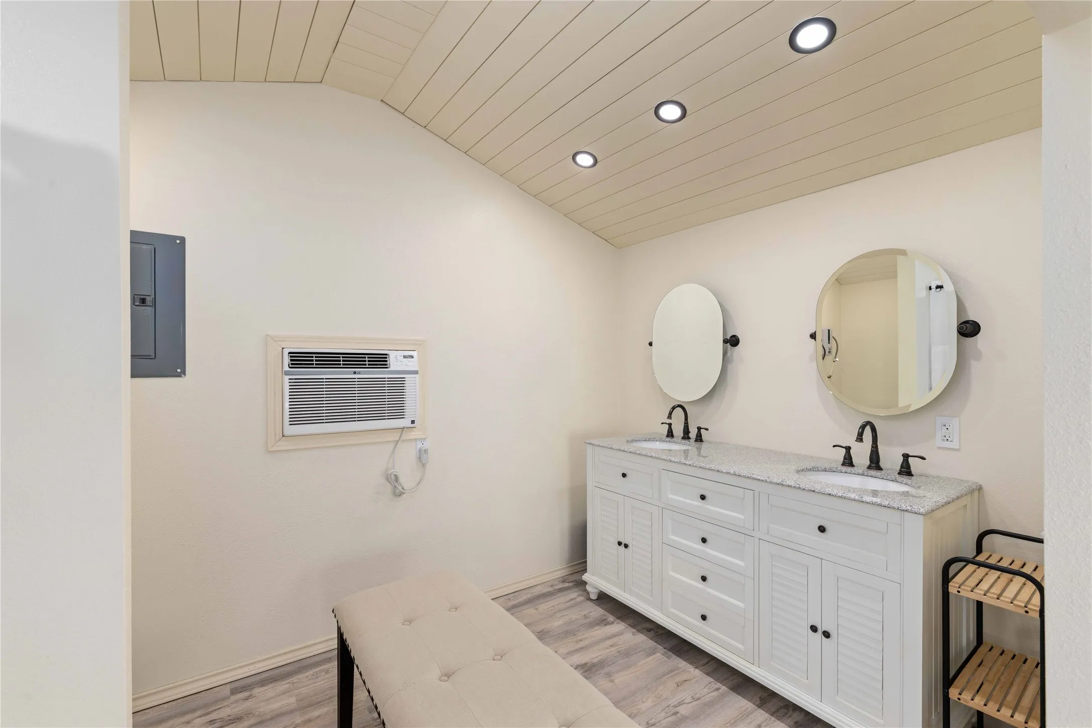 Bathroom in white cabin makes for the 3rd bedroom on property.
