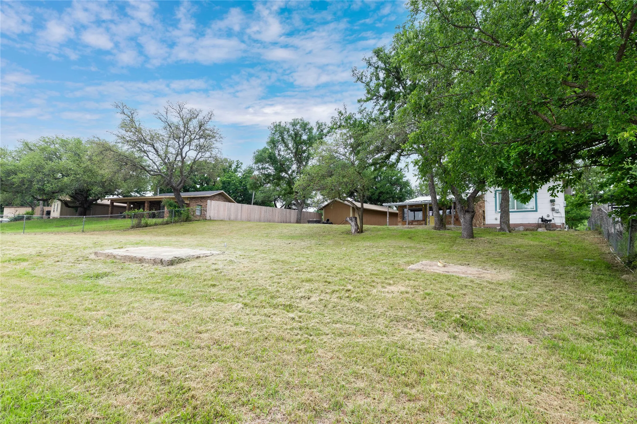 Back yard of home and outbuilding with 4th bedroom and 3rd bathroom