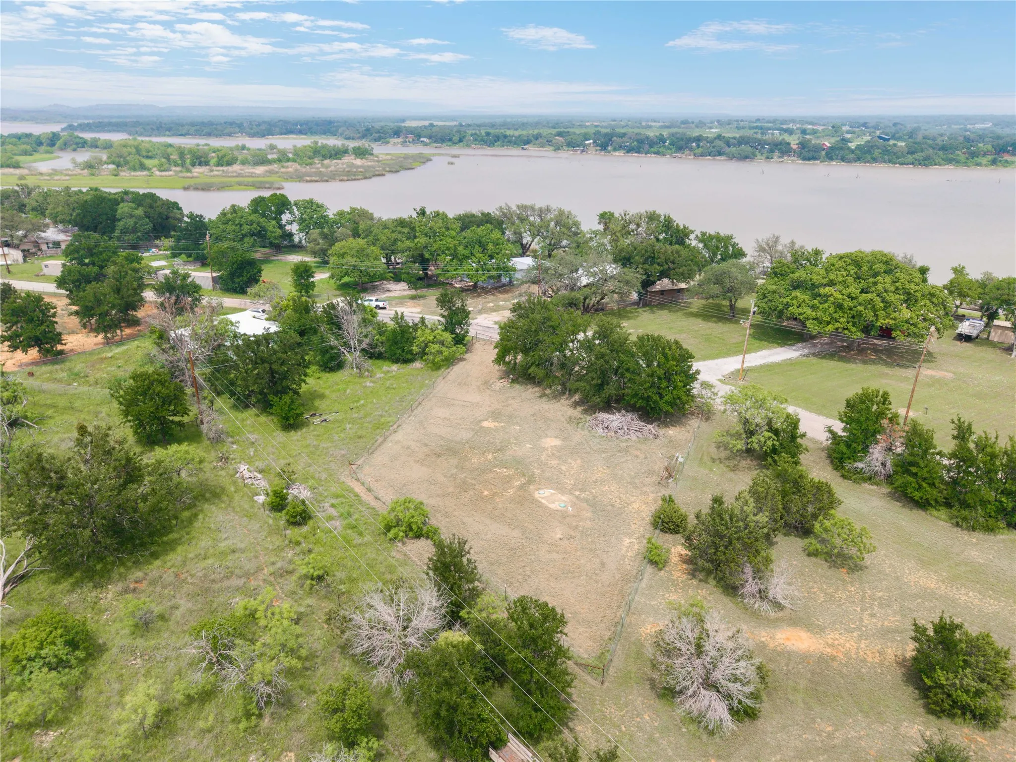 0.35 acre Lot across the street from the home, fenced with Septic tank