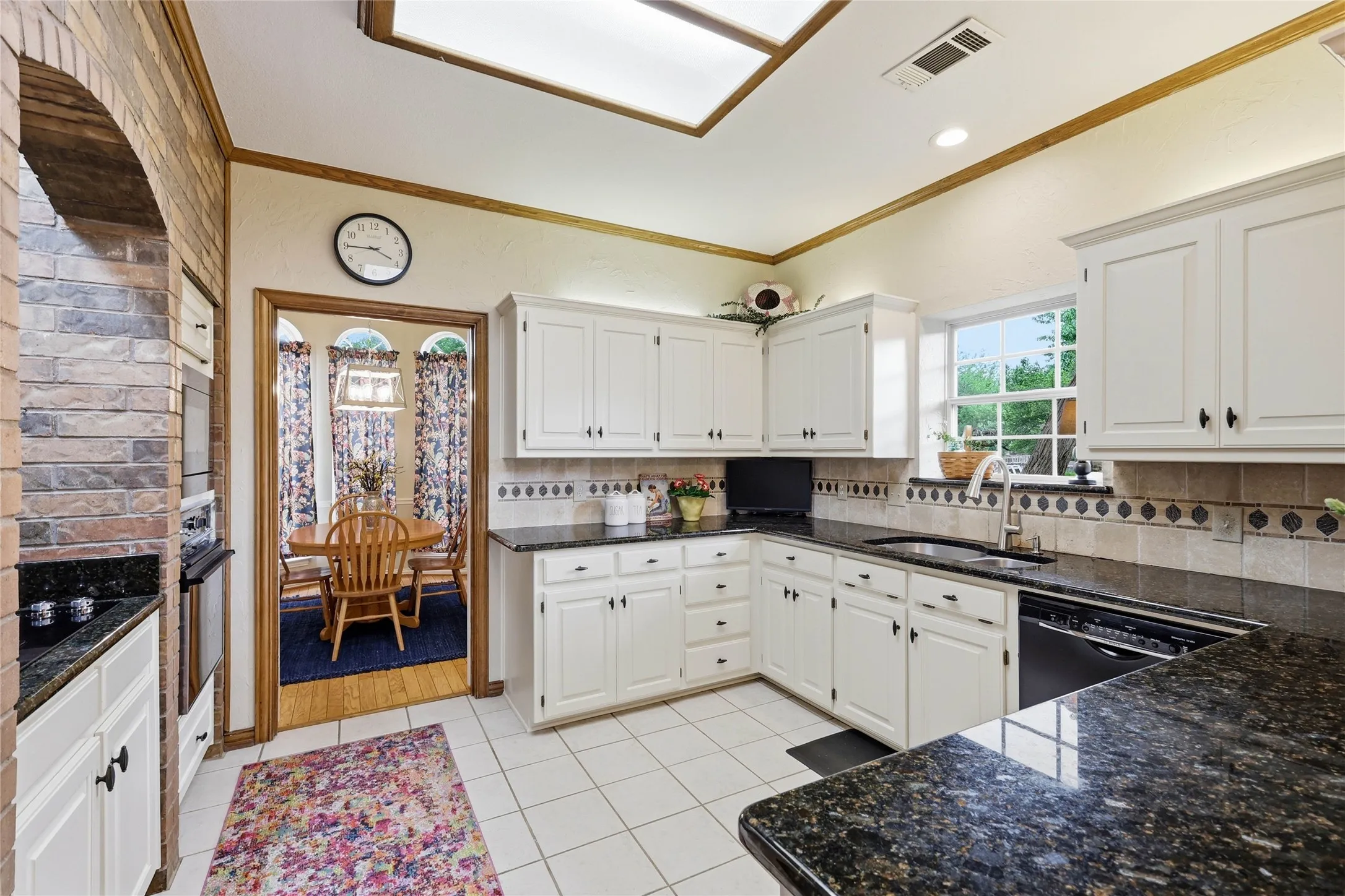 Professionally painted cabinets and granite countertops.