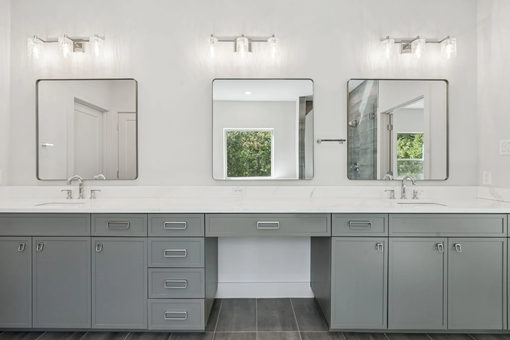 Vanity area with decorative lighting and mirrors.