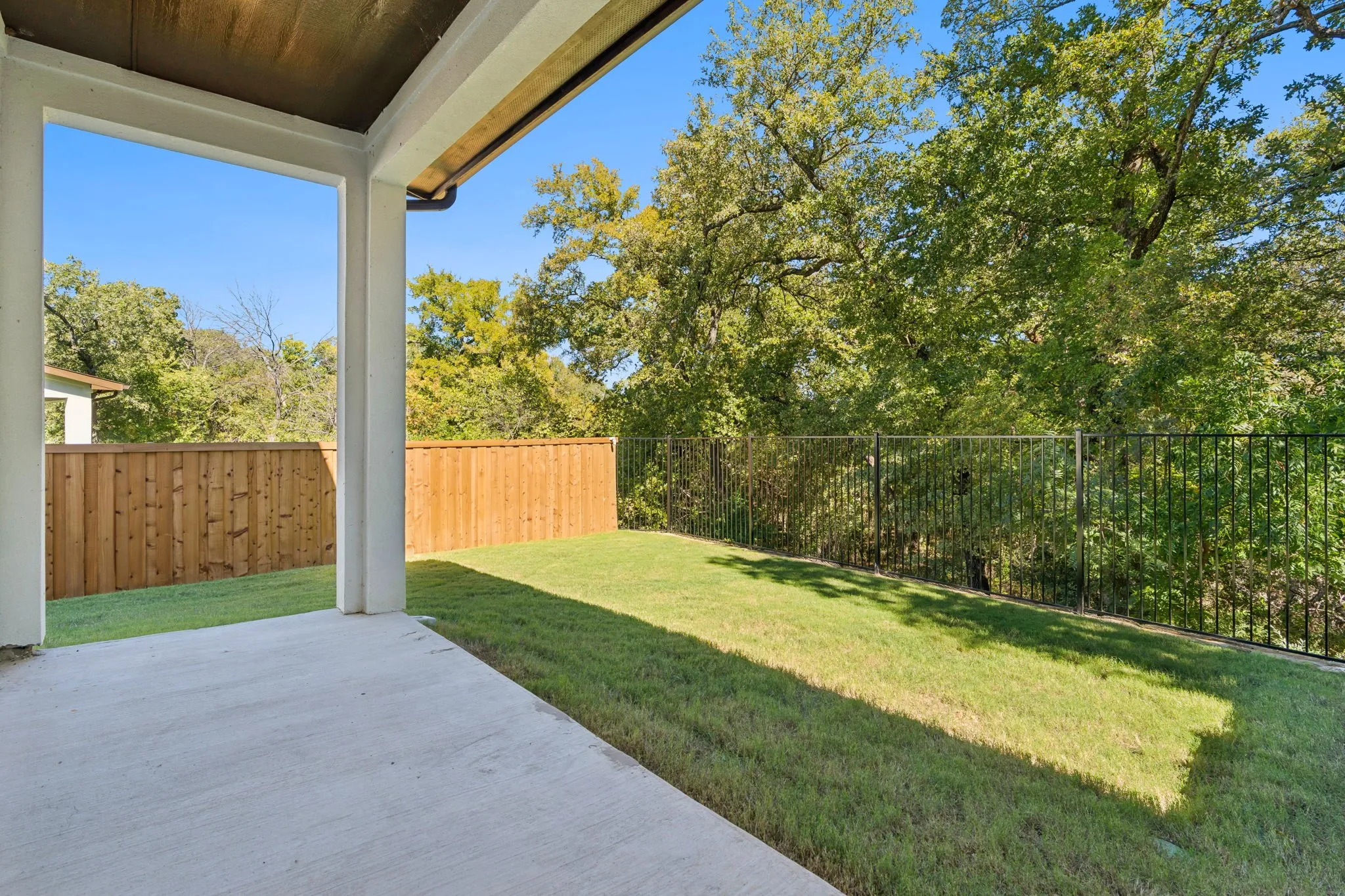 Fenced backyard and greenbelt views. Exact view and location varies by unit.