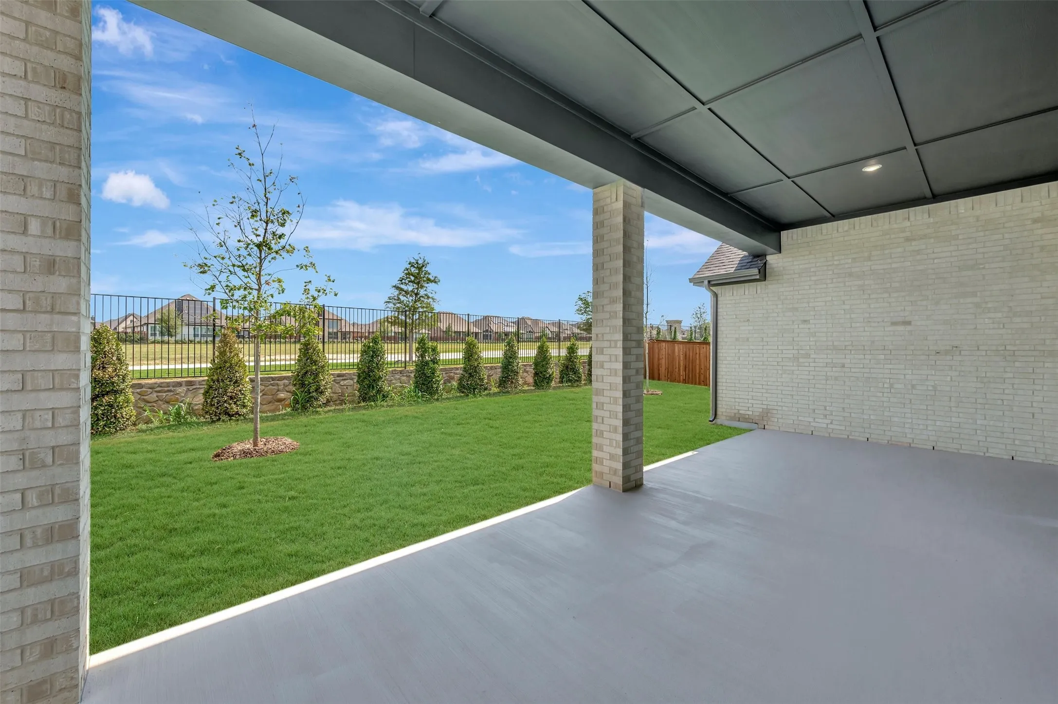 Covered patio with a concrete surface and recessed lighting