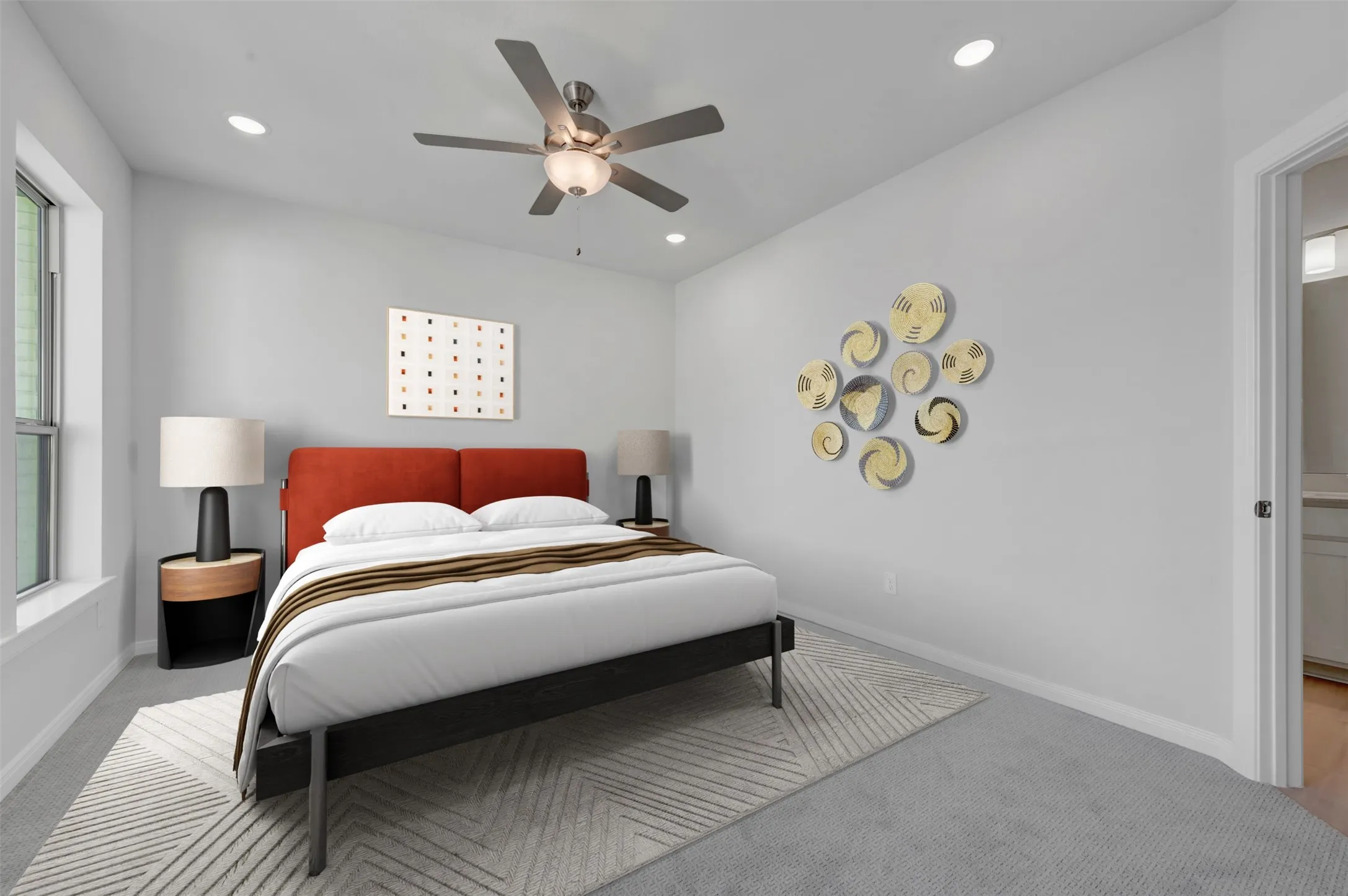 Carpeted room featuring a ceiling fan with integrated lighting, recessed lighting, and a window with white trim