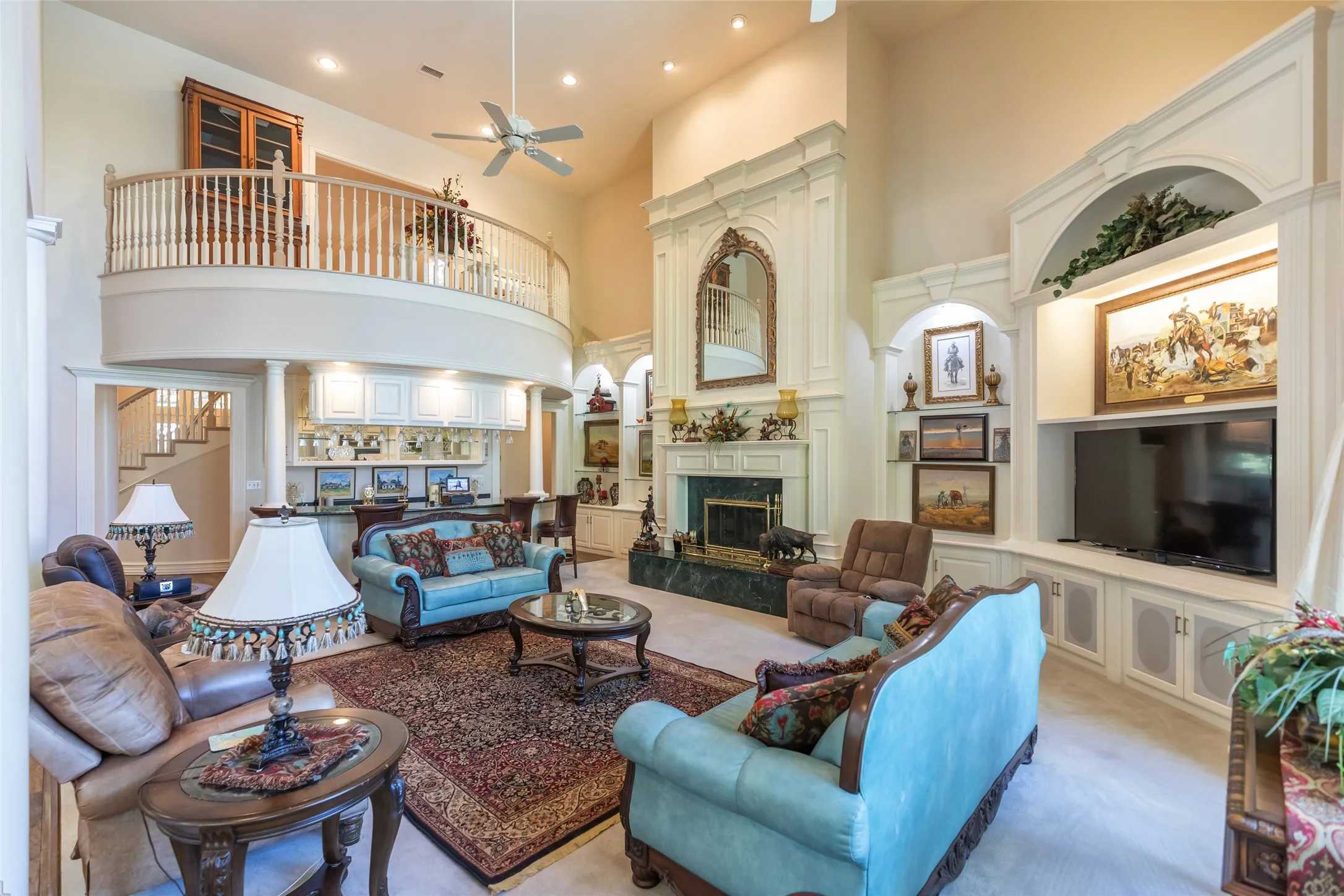 Juliet balcony overlooks living room with views of the golf course.