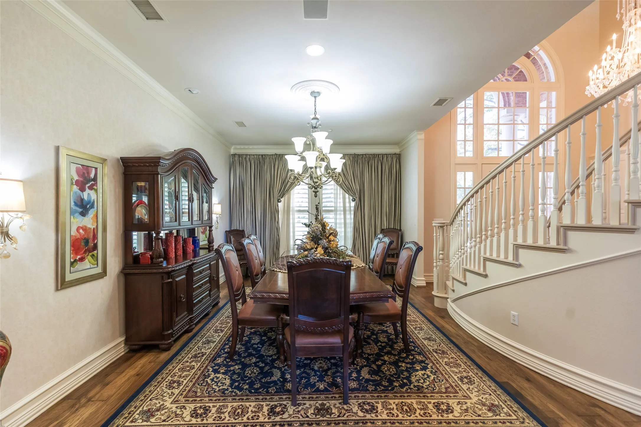 Grand formal dining room!  Hardwood floors, crown molding, beautiful sconces.