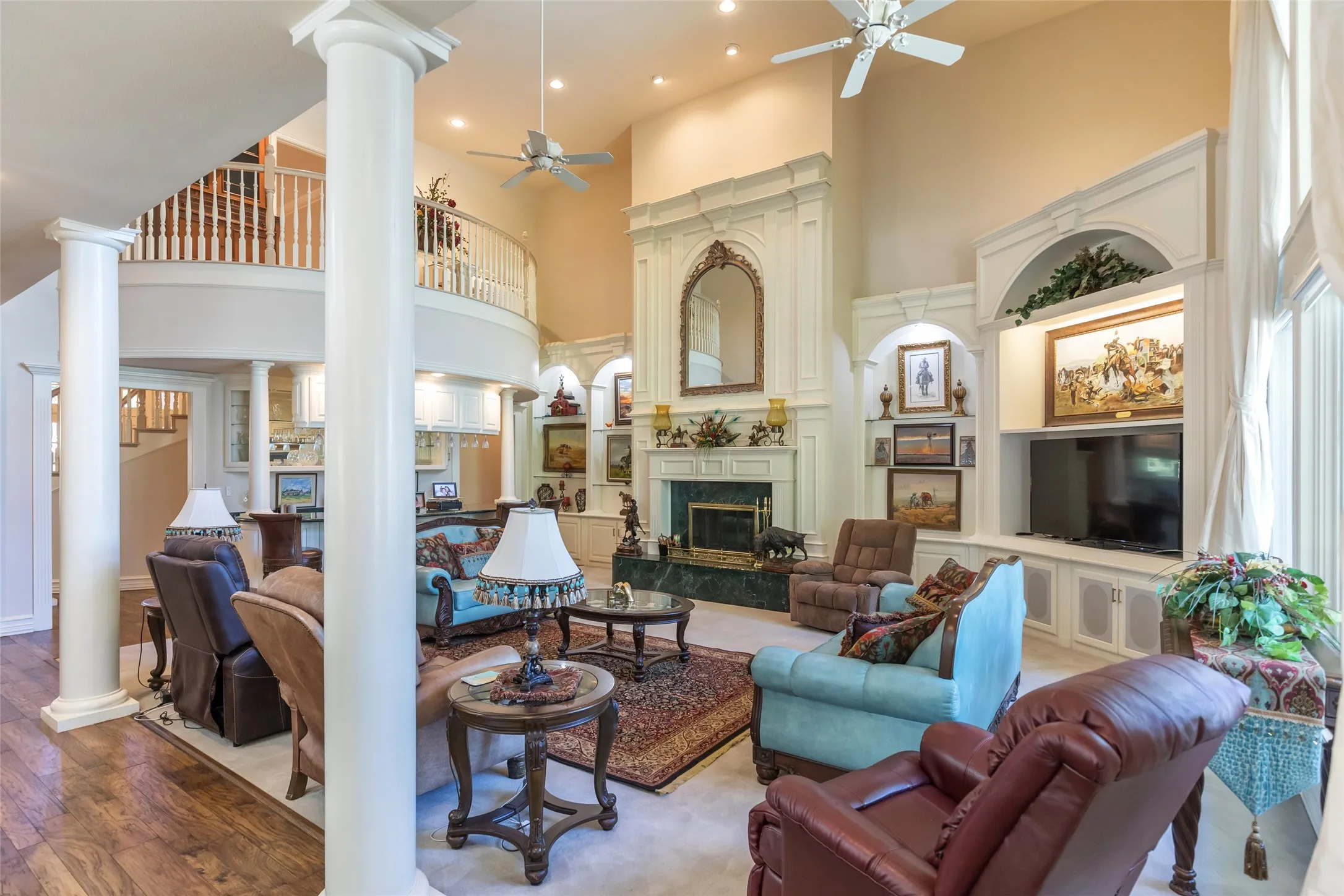 Open concept living room!  Cathedral ceilings, columns and built in cabinetry with custom moldings.