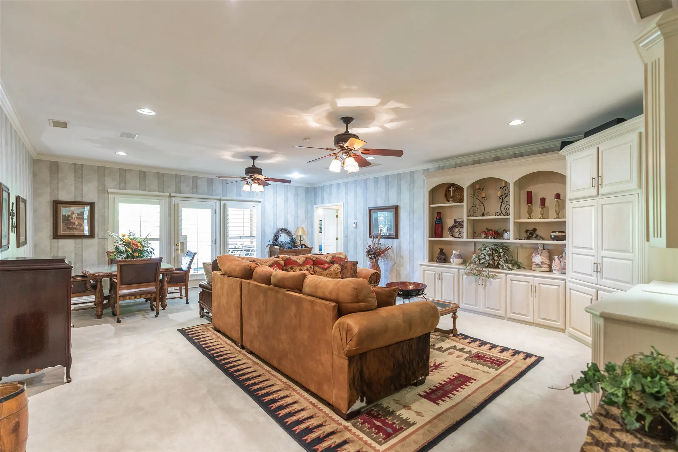 Upstairs living/game room.  Access to upstairs covered porch overlooking the golf course.