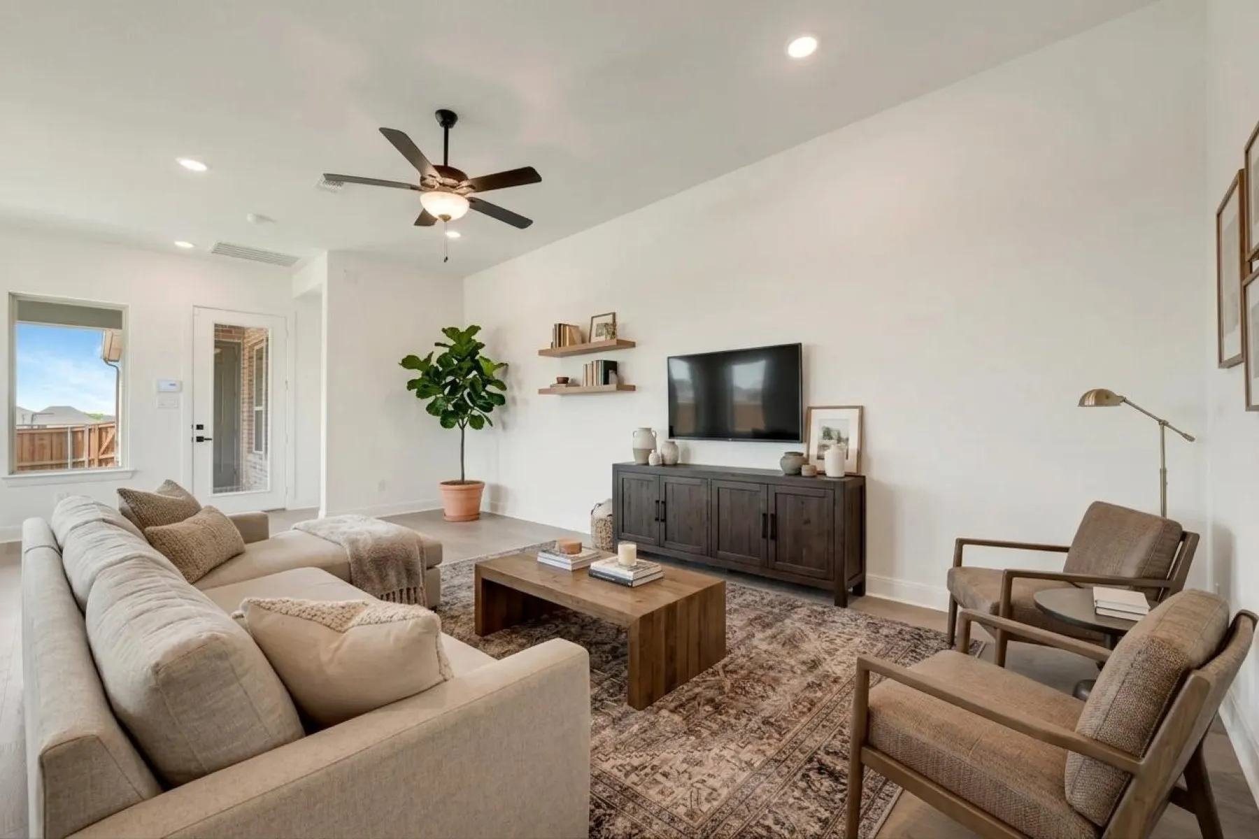 Vaulted ceilings with recessed lighting, wood-finish flooring, and a ceiling fan