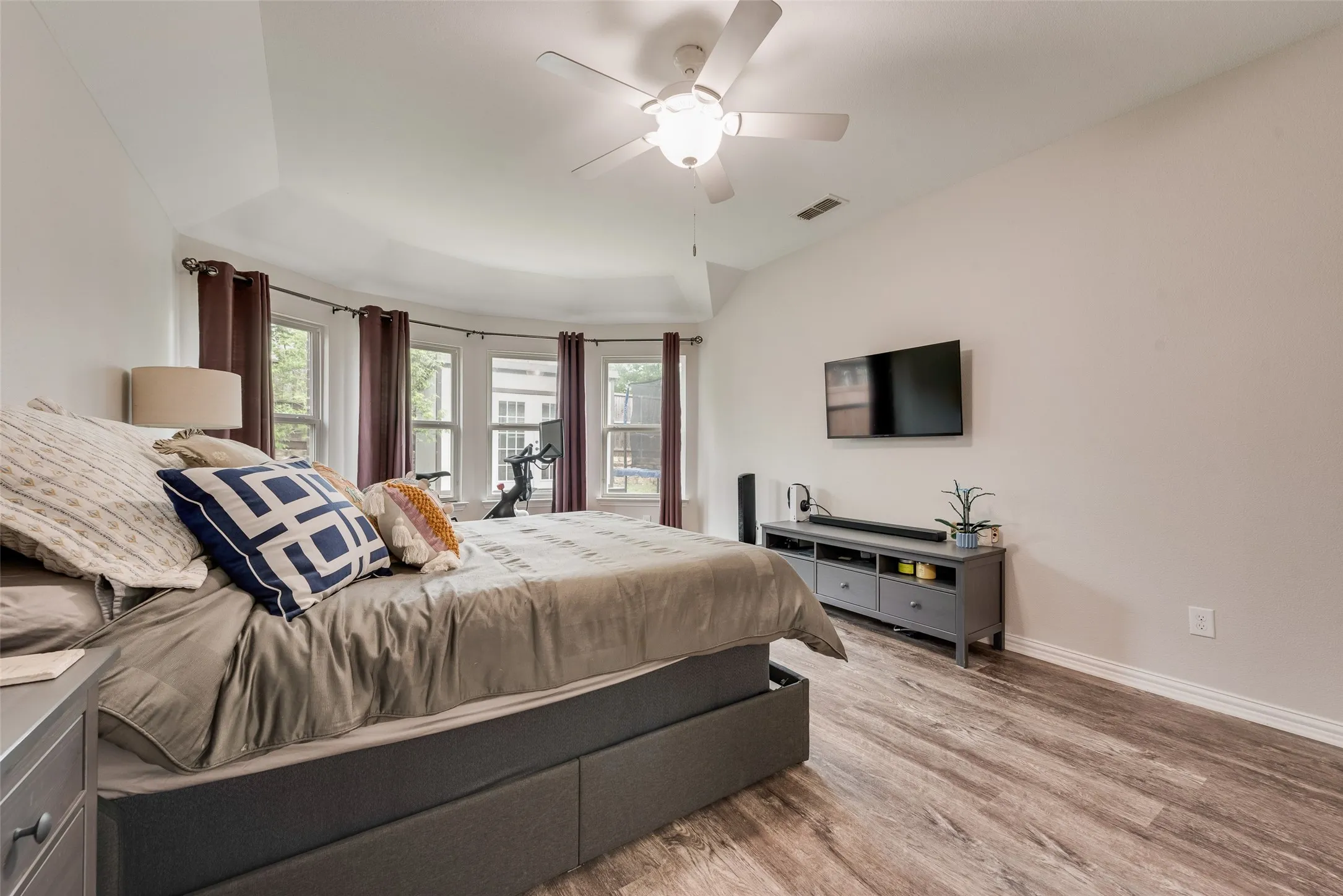 Primary bedroom with new LVP flooring, ensuite bathroom and abundant natural light at 1432 Westview Ln in the Canyon Falls community in Northlake, TX