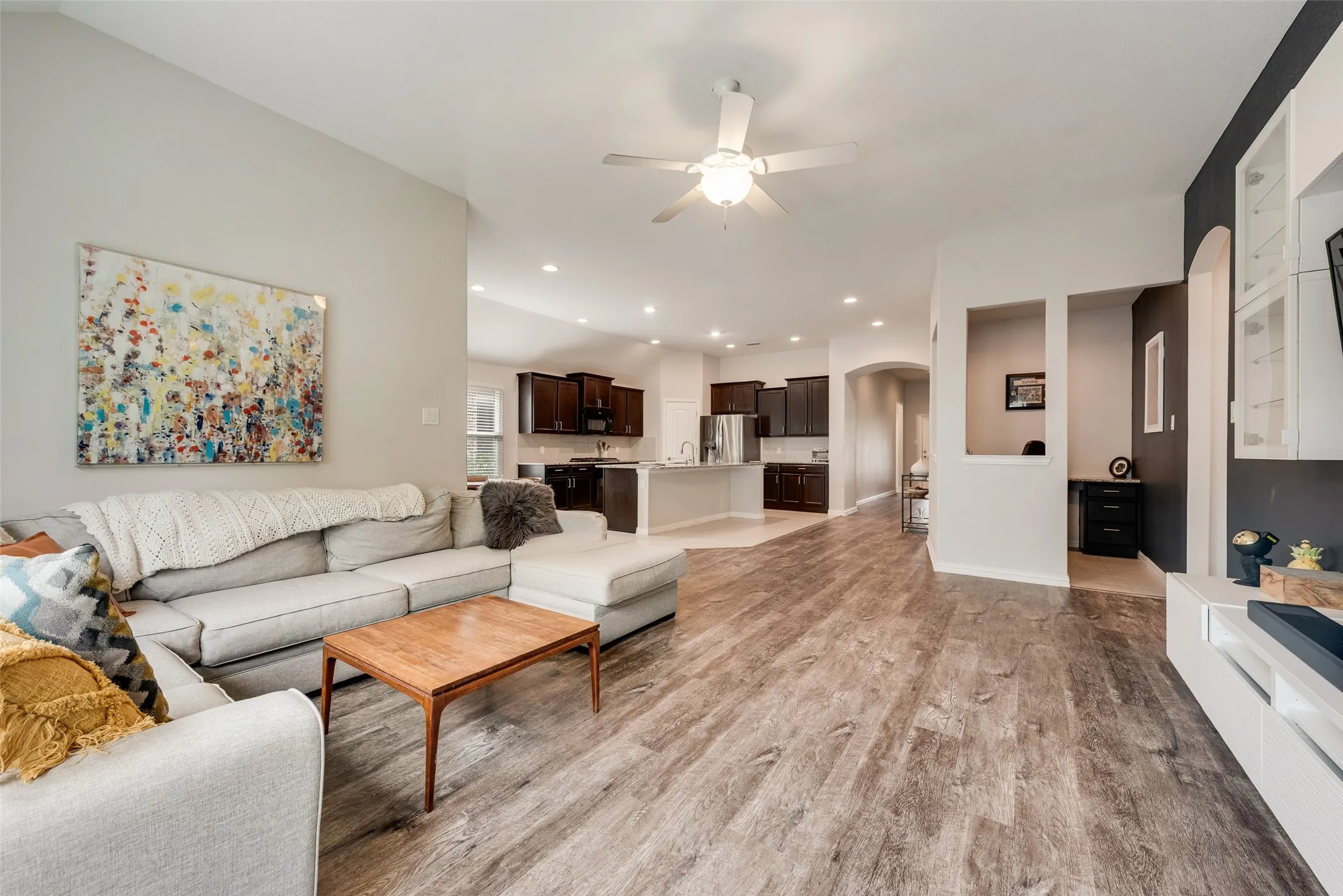 Open floor plan showcasing the new LVP floors, study nook and open kitchen