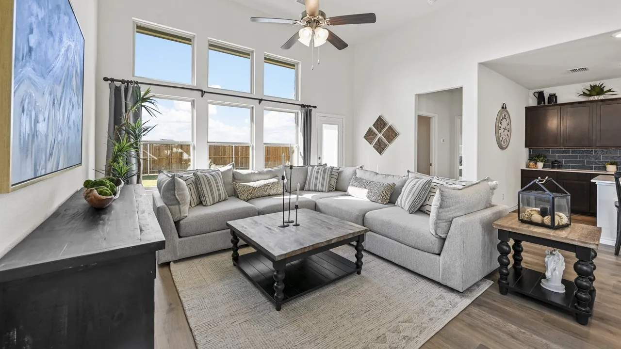 Living area with high ceilings and wood-finish flooring