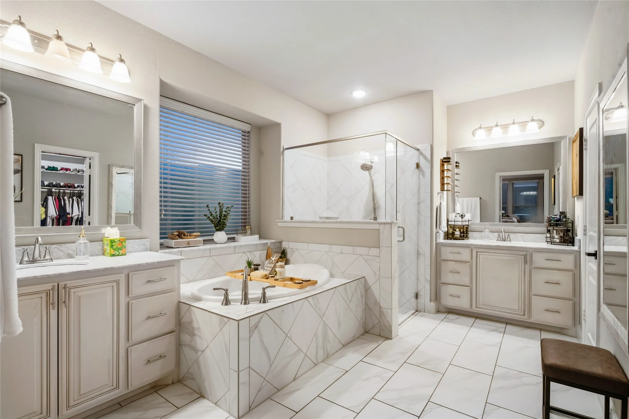 The large Primary bathroom has a separate showing and tub plus separate vanities.