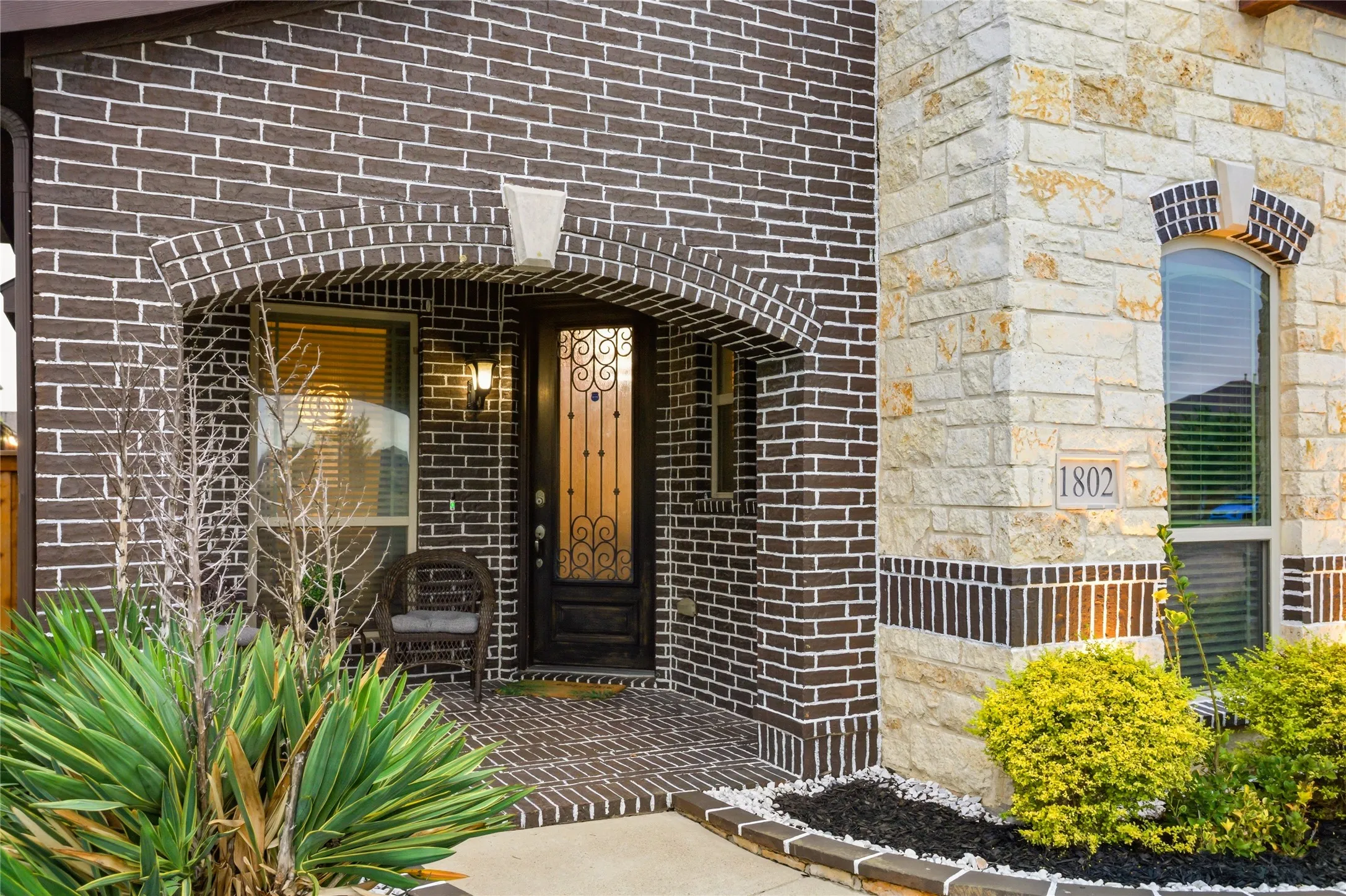 It features a beautiful covered front porch.