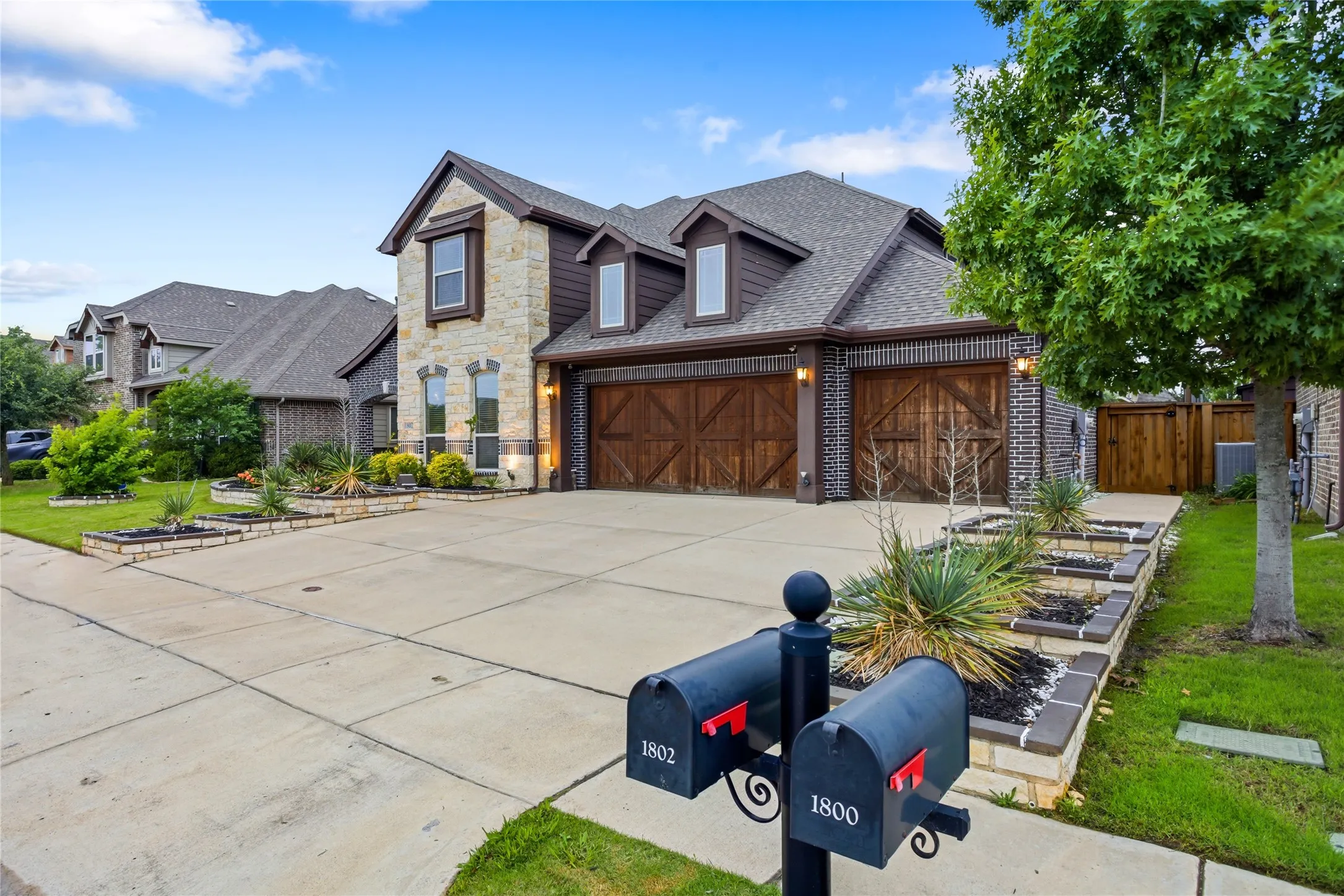 The home has a large 3-car garage and driveway.